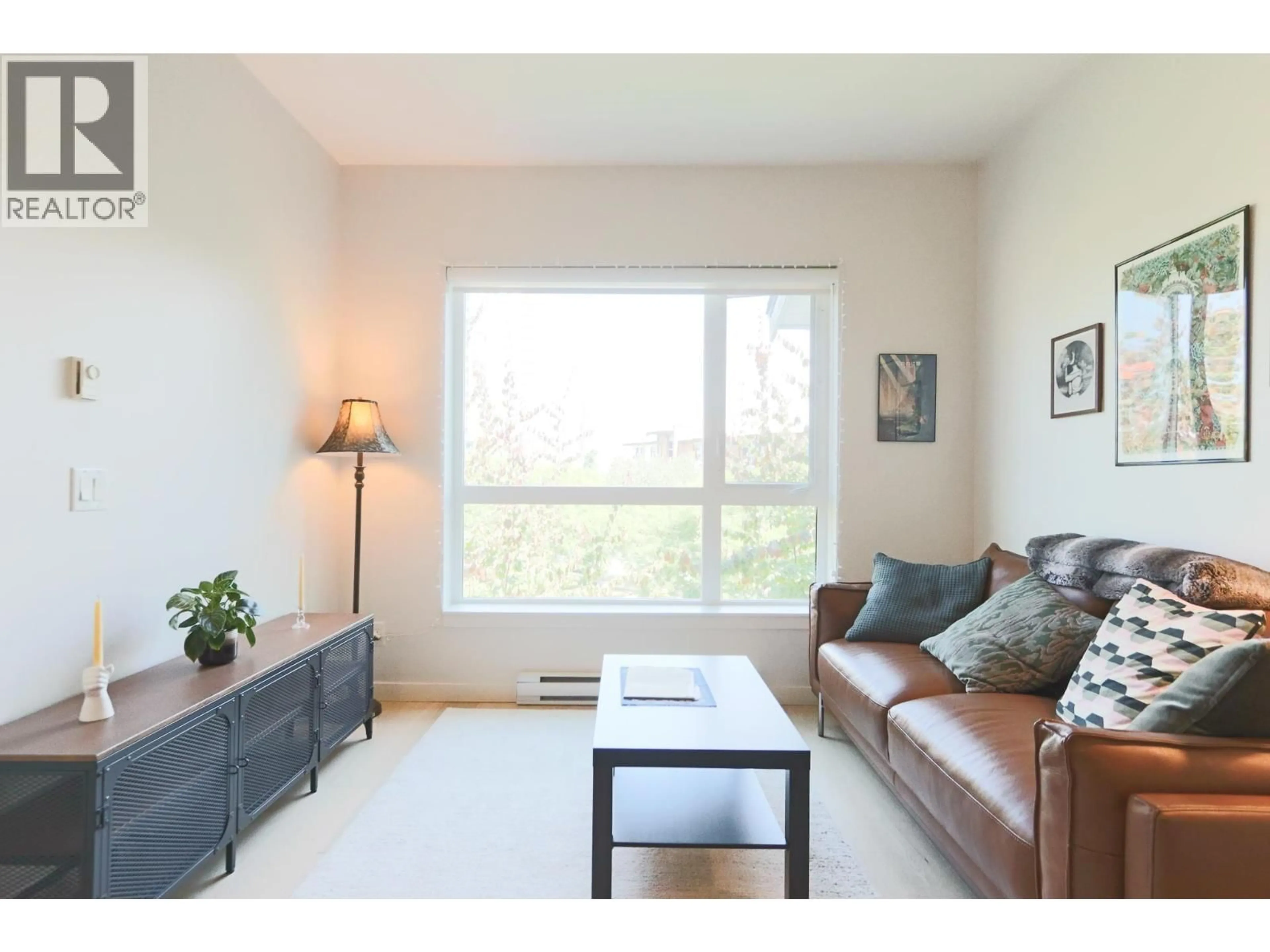 Living room with furniture, wood/laminate floor for 304 - 215 BROOKES STREET, New Westminster British Columbia V3M0G5