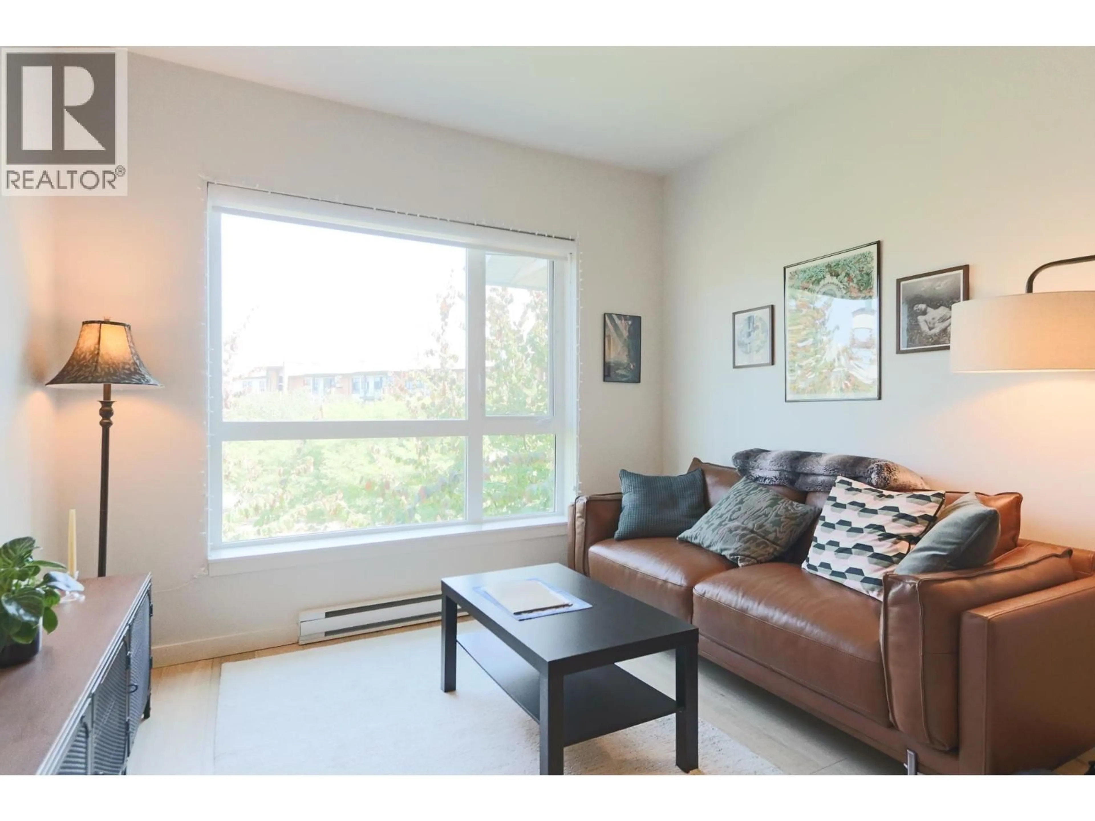Living room with furniture, wood/laminate floor for 304 - 215 BROOKES STREET, New Westminster British Columbia V3M0G5