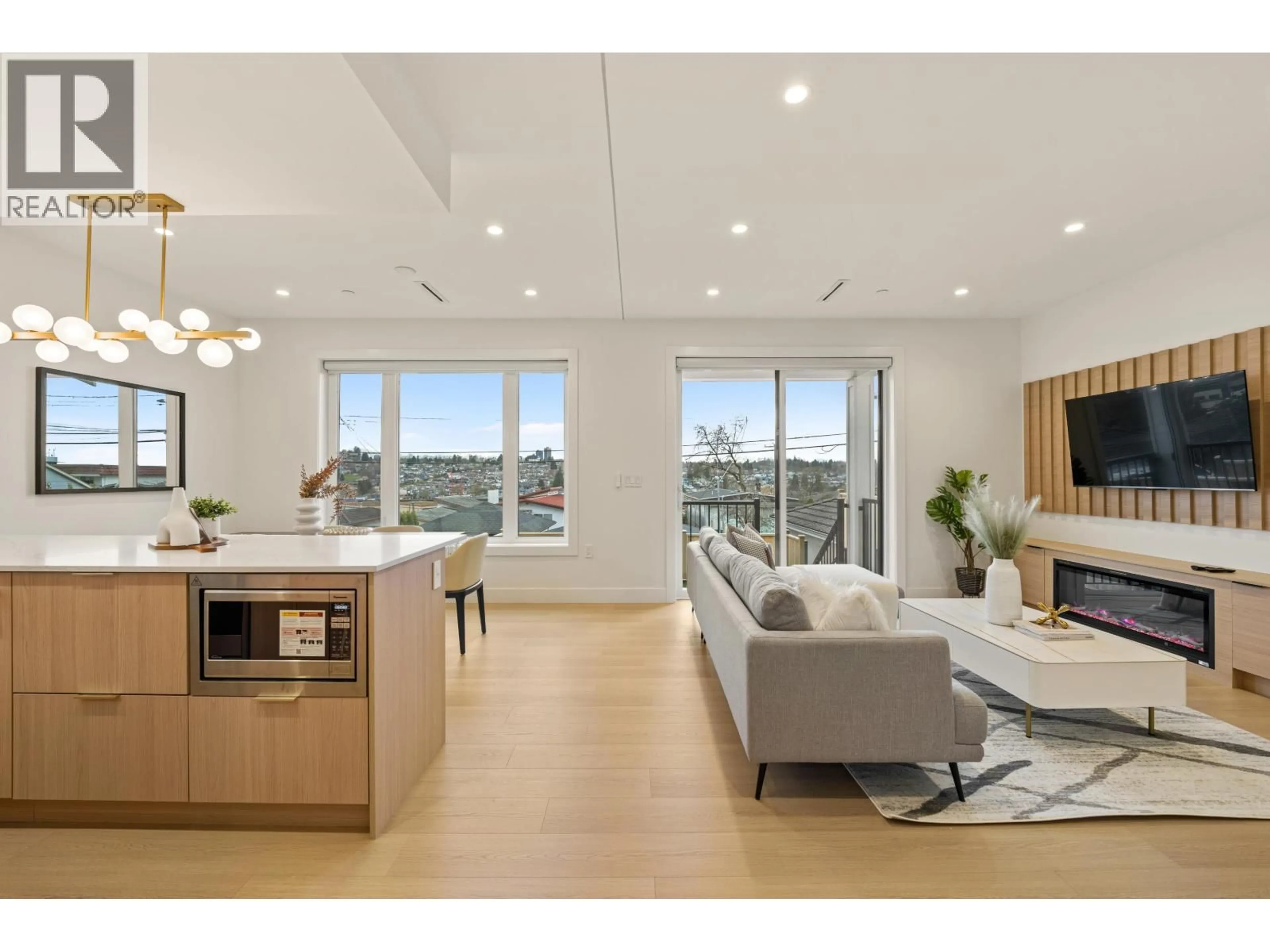 Living room with furniture, wood/laminate floor for 3156-2 8TH AVENUE, Vancouver British Columbia V5M1X6