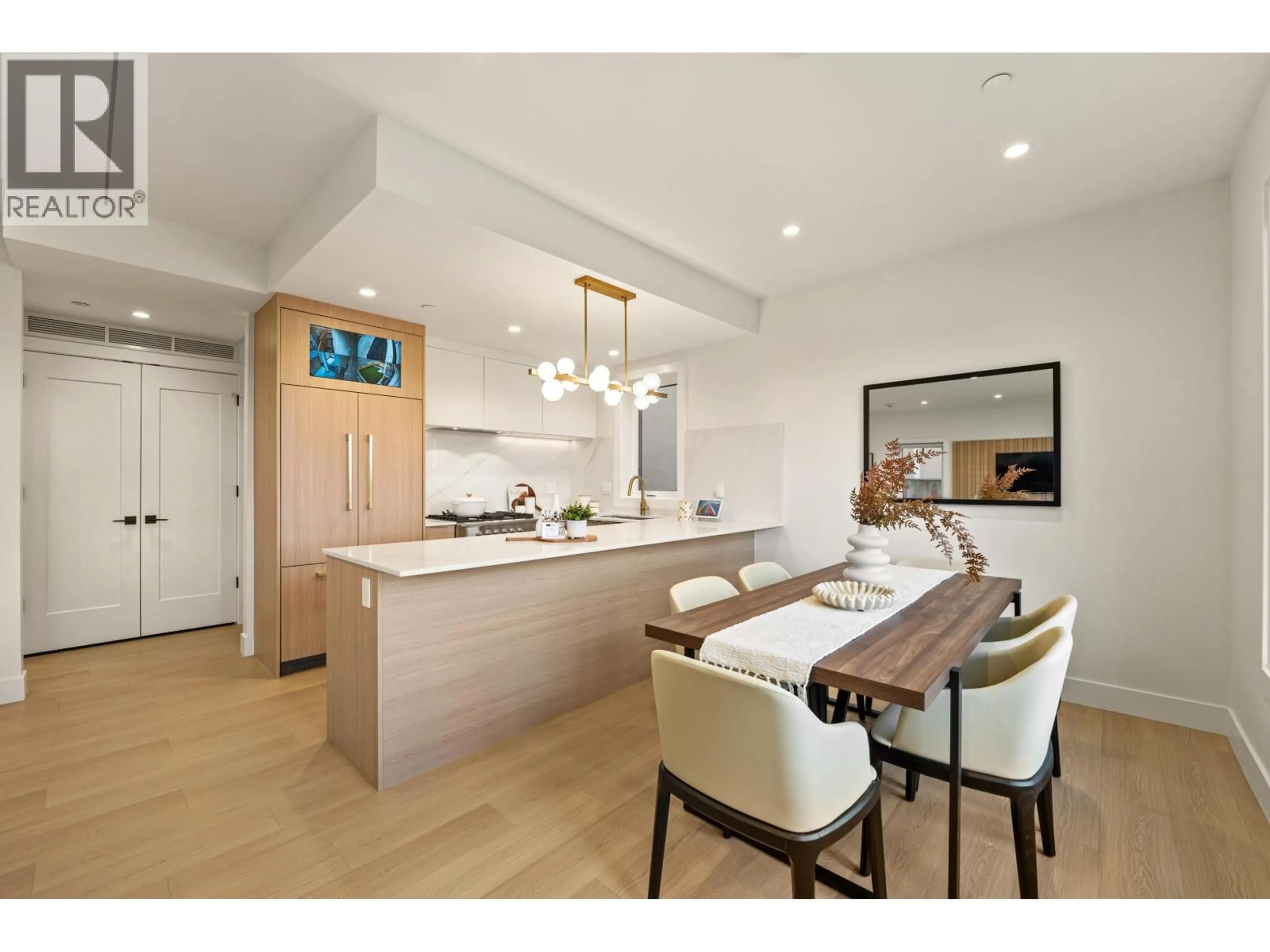 Open concept kitchen, wood/laminate floor for 3156-2 8TH AVENUE, Vancouver British Columbia V5M1X6