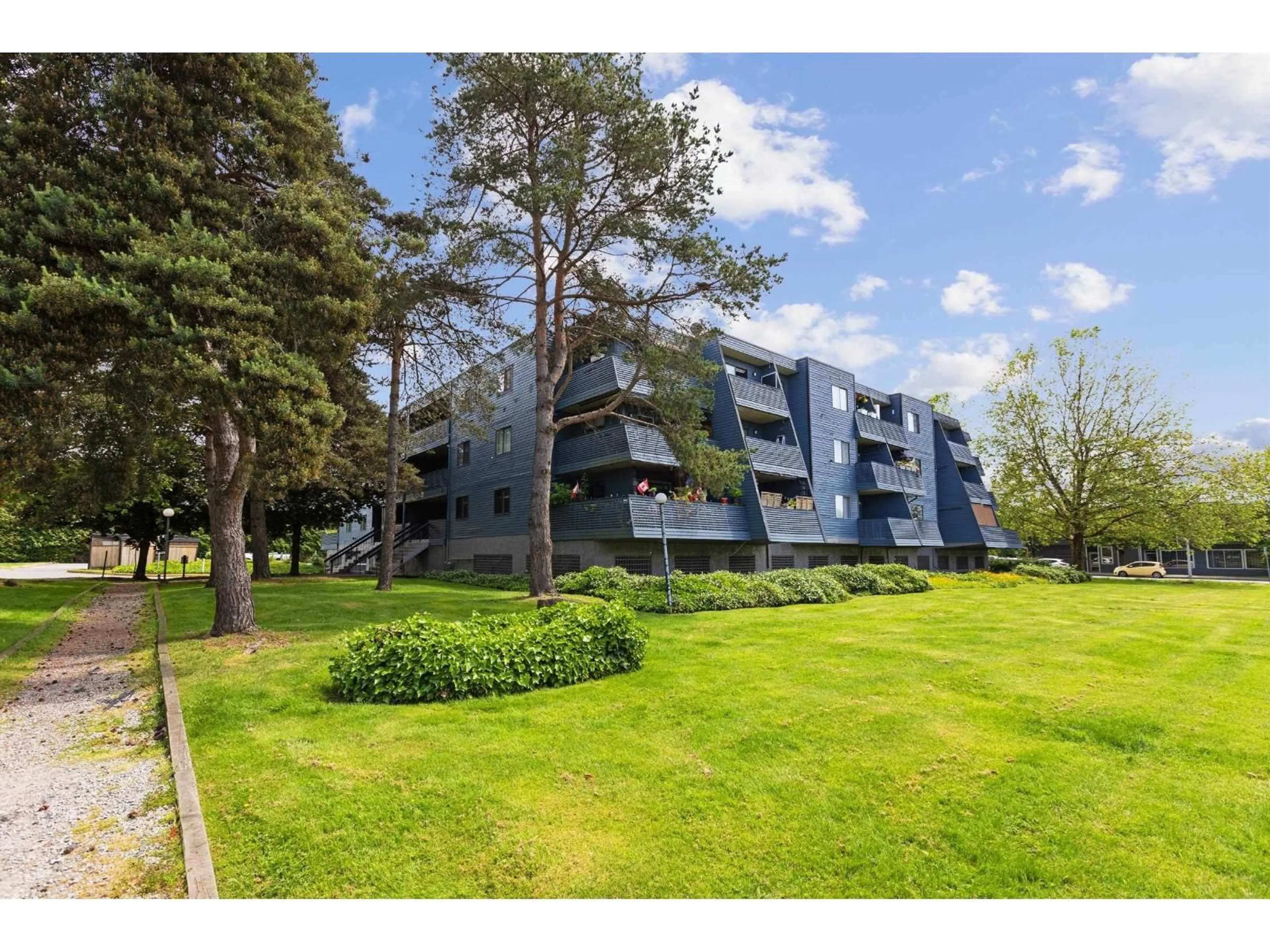 A pic from outside/outdoor area/front of a property/back of a property/a pic from drone, forest/trees view for 212 - 17661 58A AVENUE, Surrey British Columbia V3S1N4