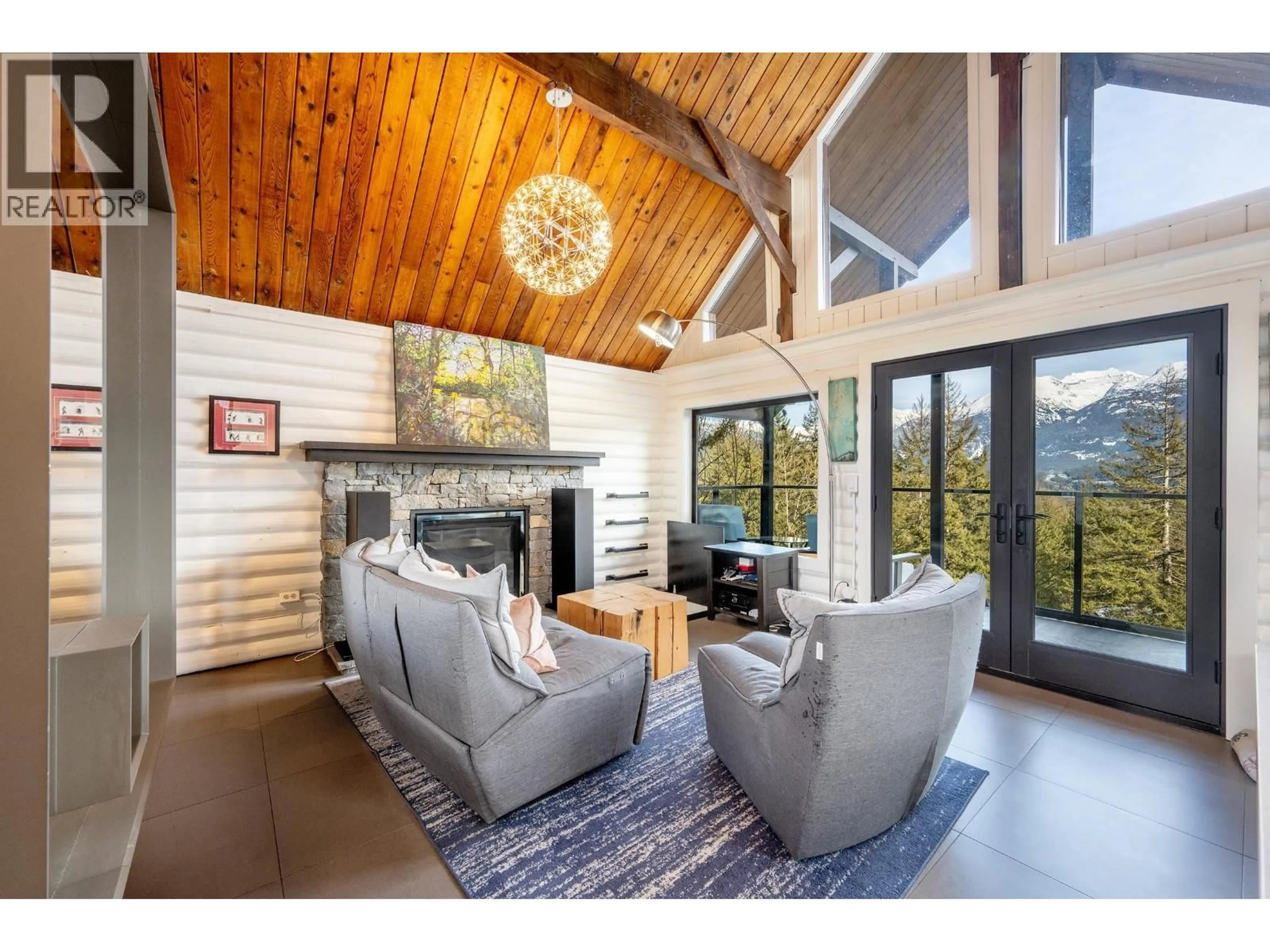 Living room with furniture, wood/laminate floor for 8706 WEDGEVIEW PLACE, Whistler British Columbia V8E0G1