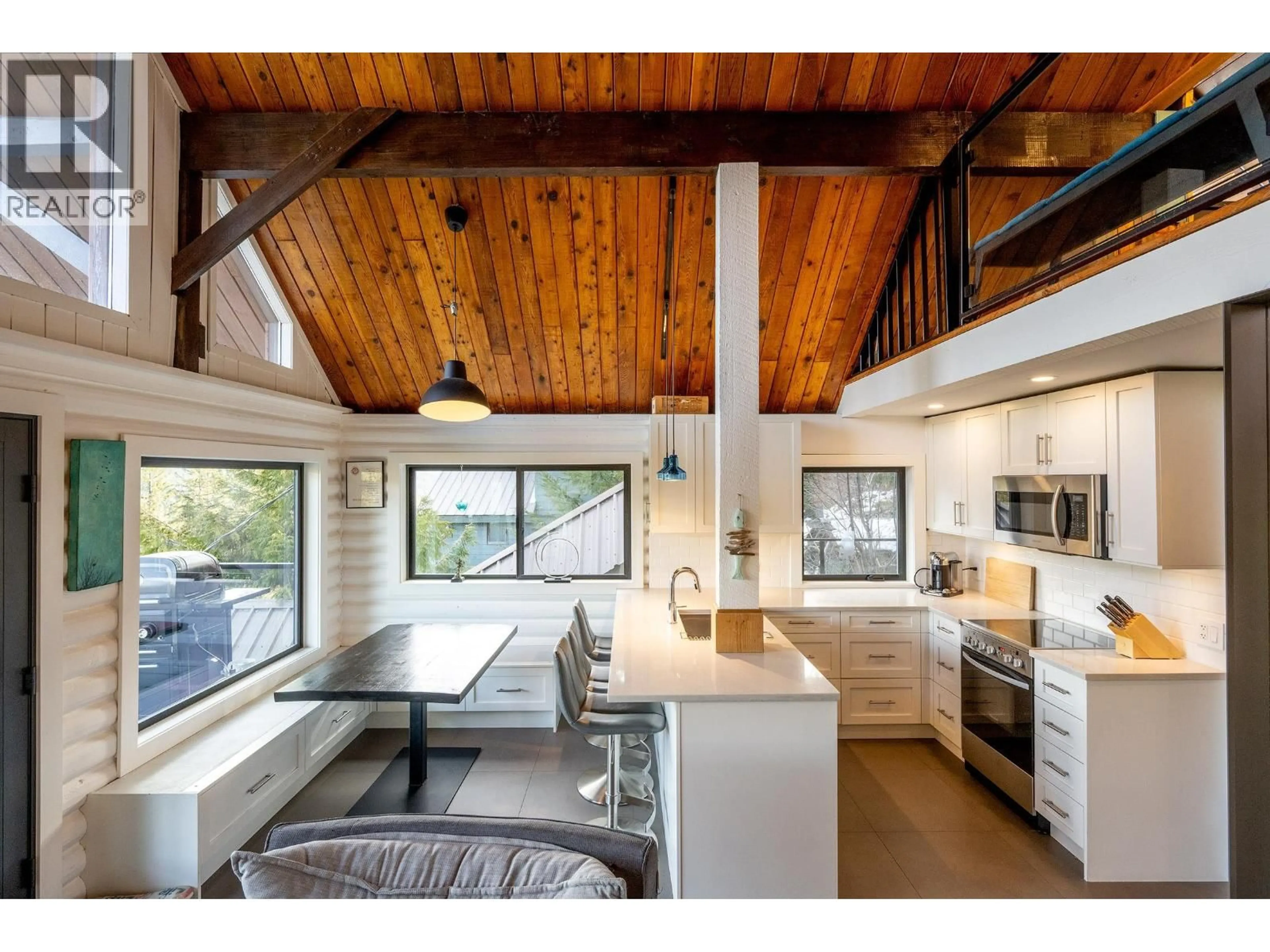 Open concept kitchen, wood/laminate floor for 8706 WEDGEVIEW PLACE, Whistler British Columbia V8E0G1