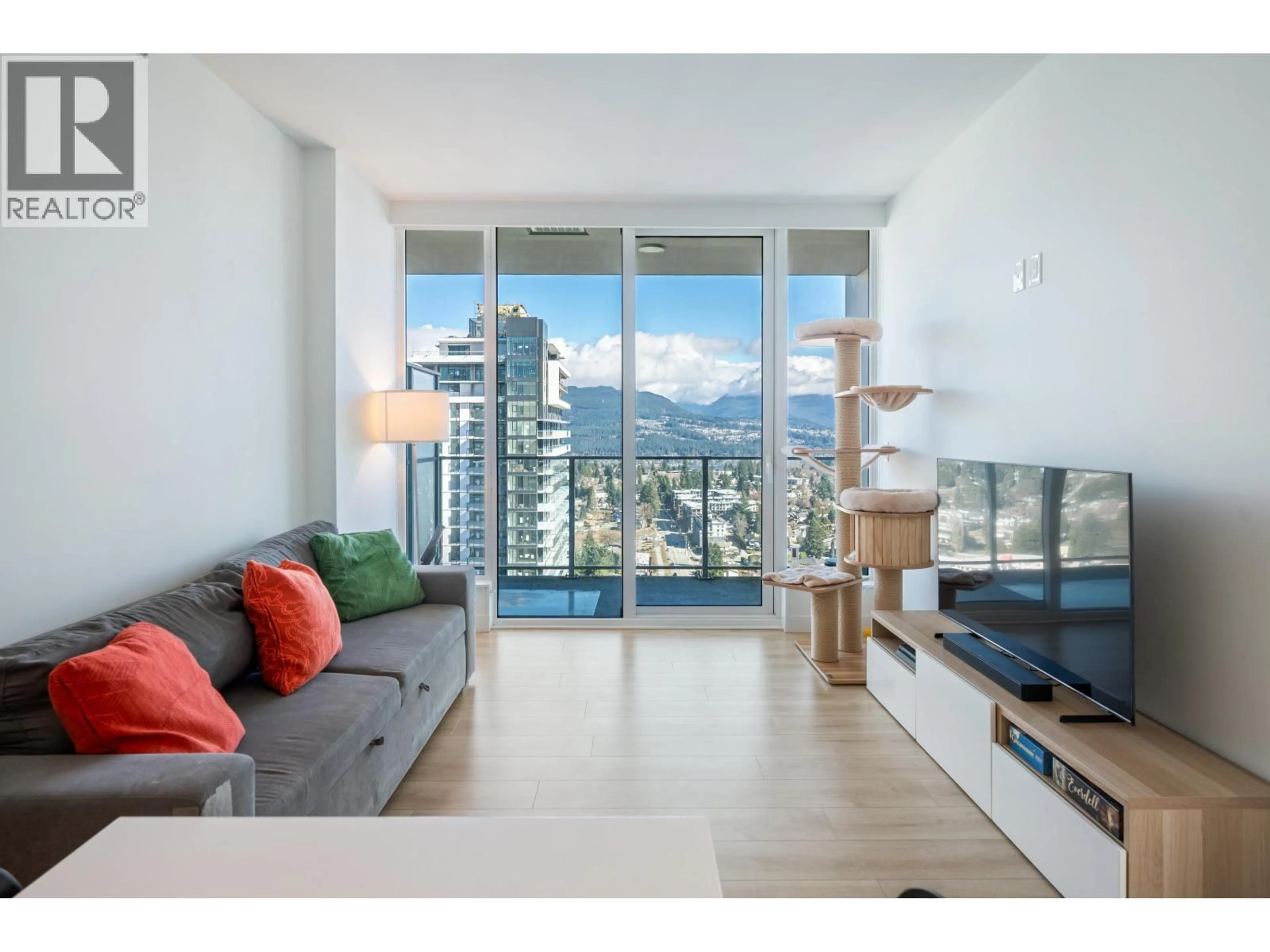 Living room with furniture, wood/laminate floor for 3205 - 567 CLARKE ROAD, Coquitlam British Columbia V3J0K7