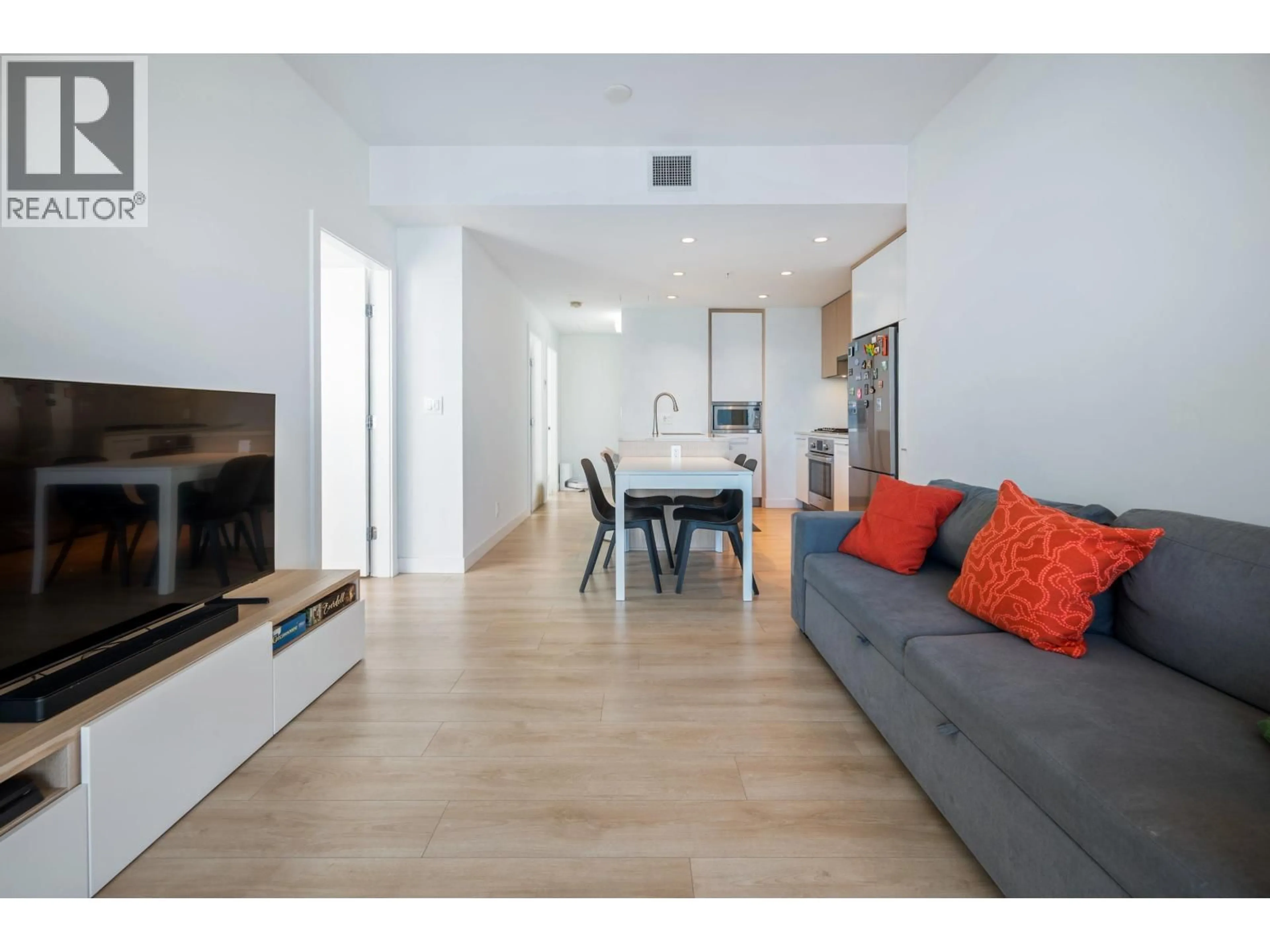 Living room with furniture, wood/laminate floor for 3205 - 567 CLARKE ROAD, Coquitlam British Columbia V3J0K7