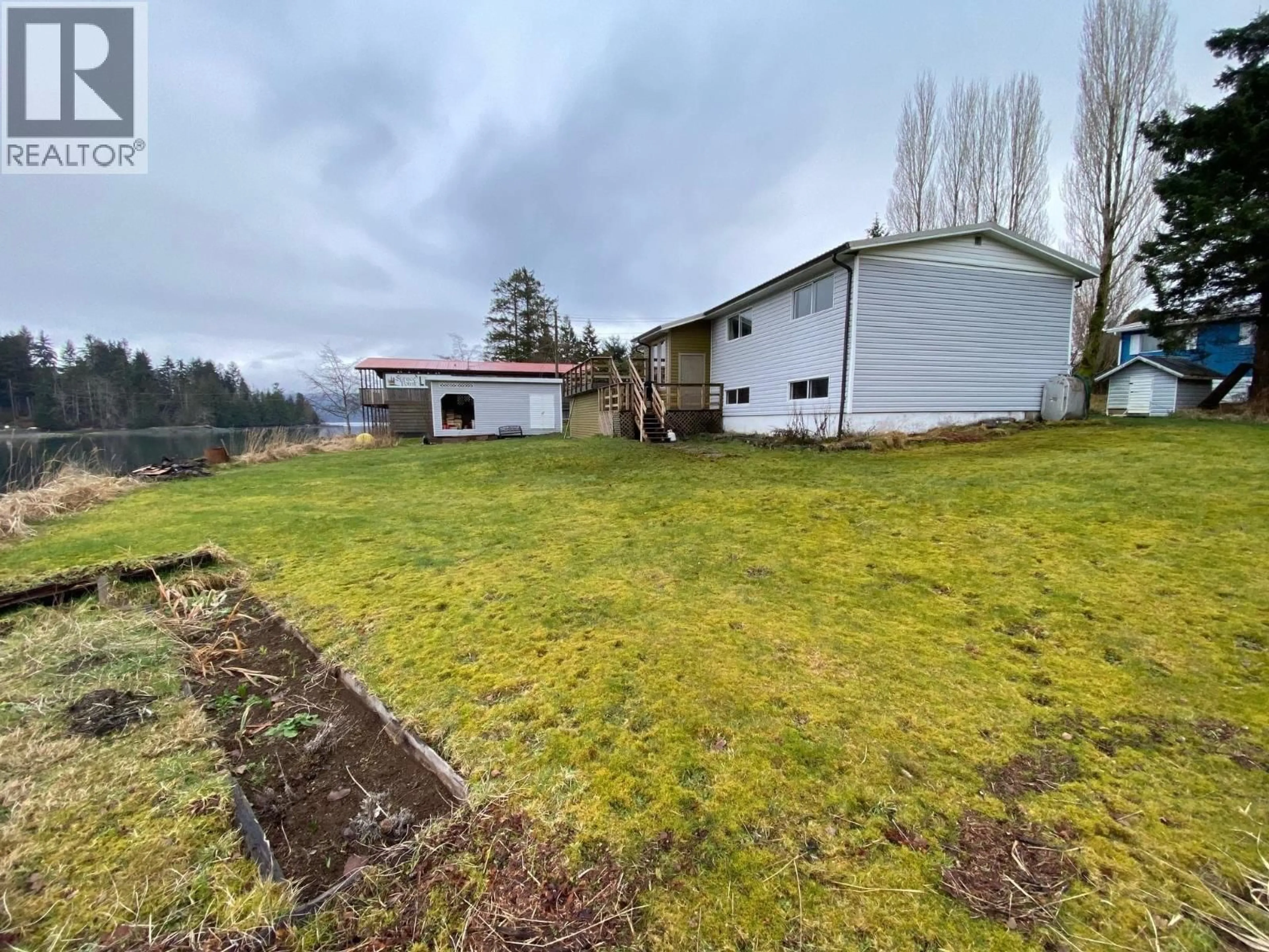 A pic from outside/outdoor area/front of a property/back of a property/a pic from drone, unknown for 614 5TH AVENUE, Daajing Giids City British Columbia V0T1S0