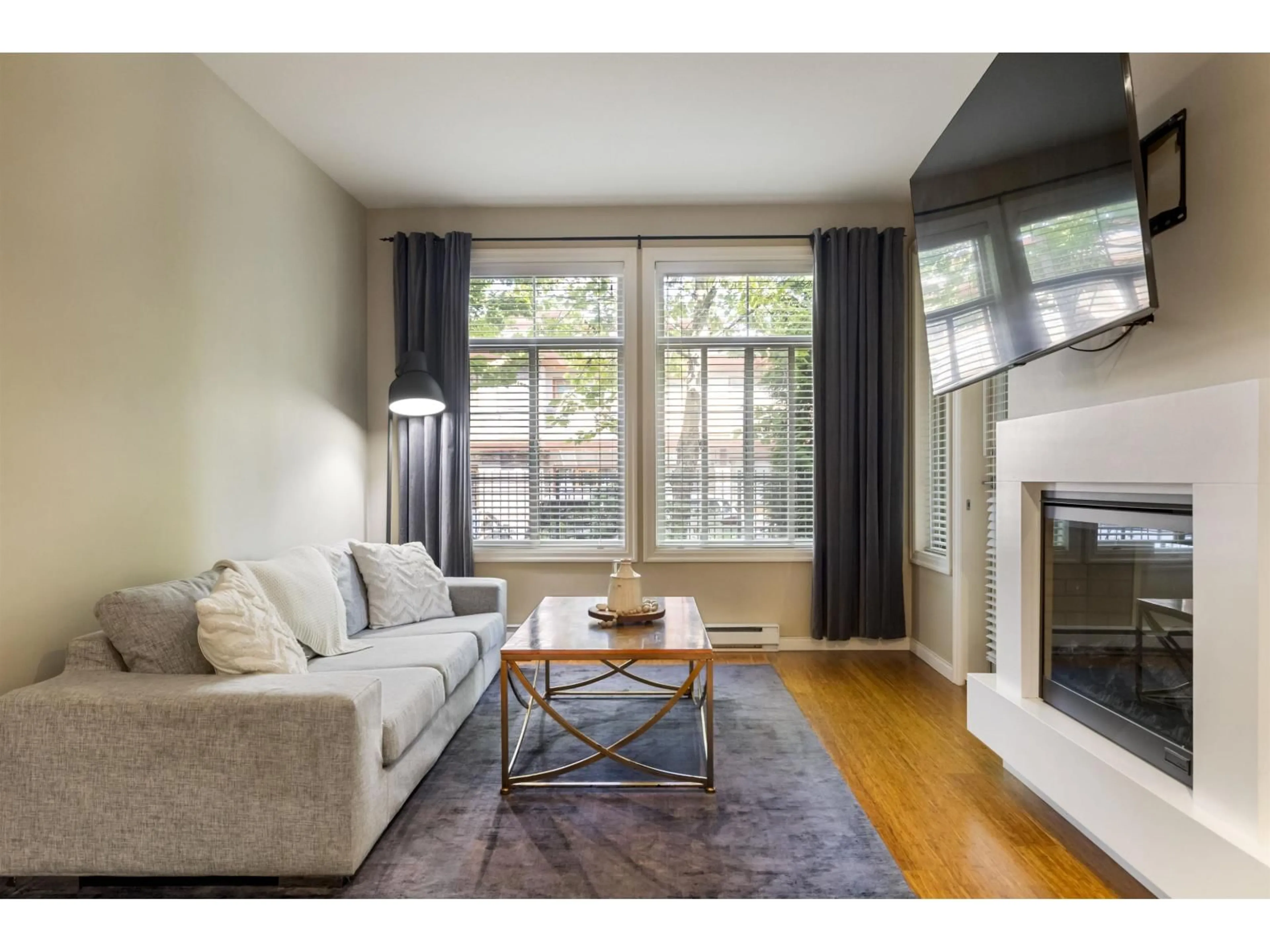 Living room with furniture, wood/laminate floor for 111 - 3355 ROSEMARY HEIGHTS DRIVE, Surrey British Columbia V3Z2H5