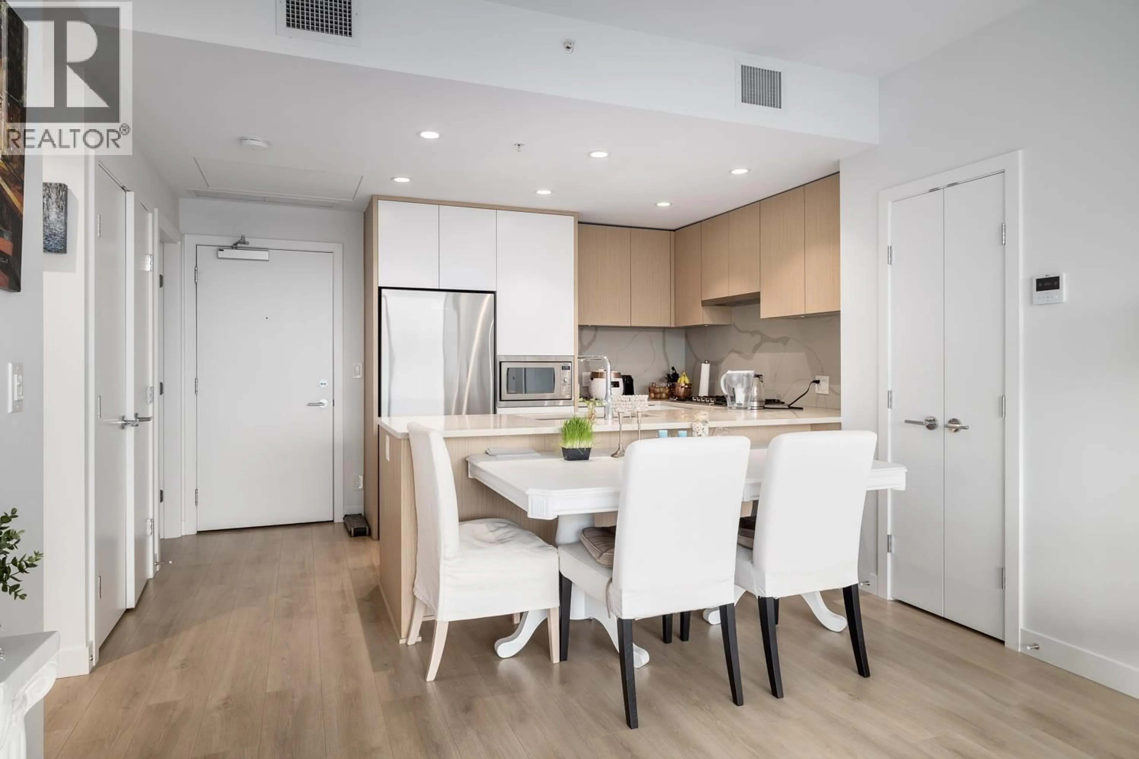 Open concept kitchen, wood/laminate floor for 3002 - 567 CLARKE ROAD, Coquitlam British Columbia V3J0K7