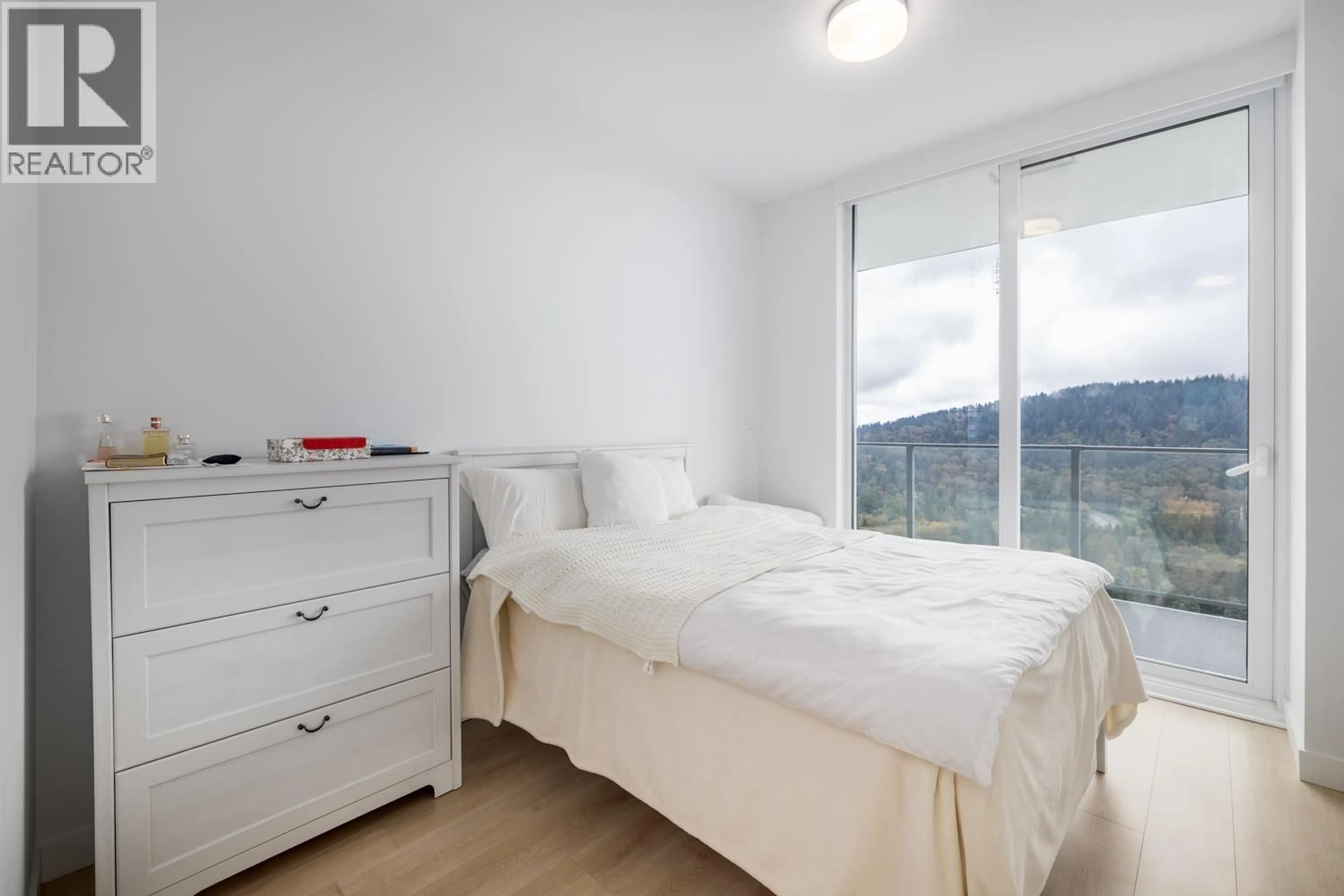 Bedroom with bed, wood/laminate floor for 3002 - 567 CLARKE ROAD, Coquitlam British Columbia V3J0K7