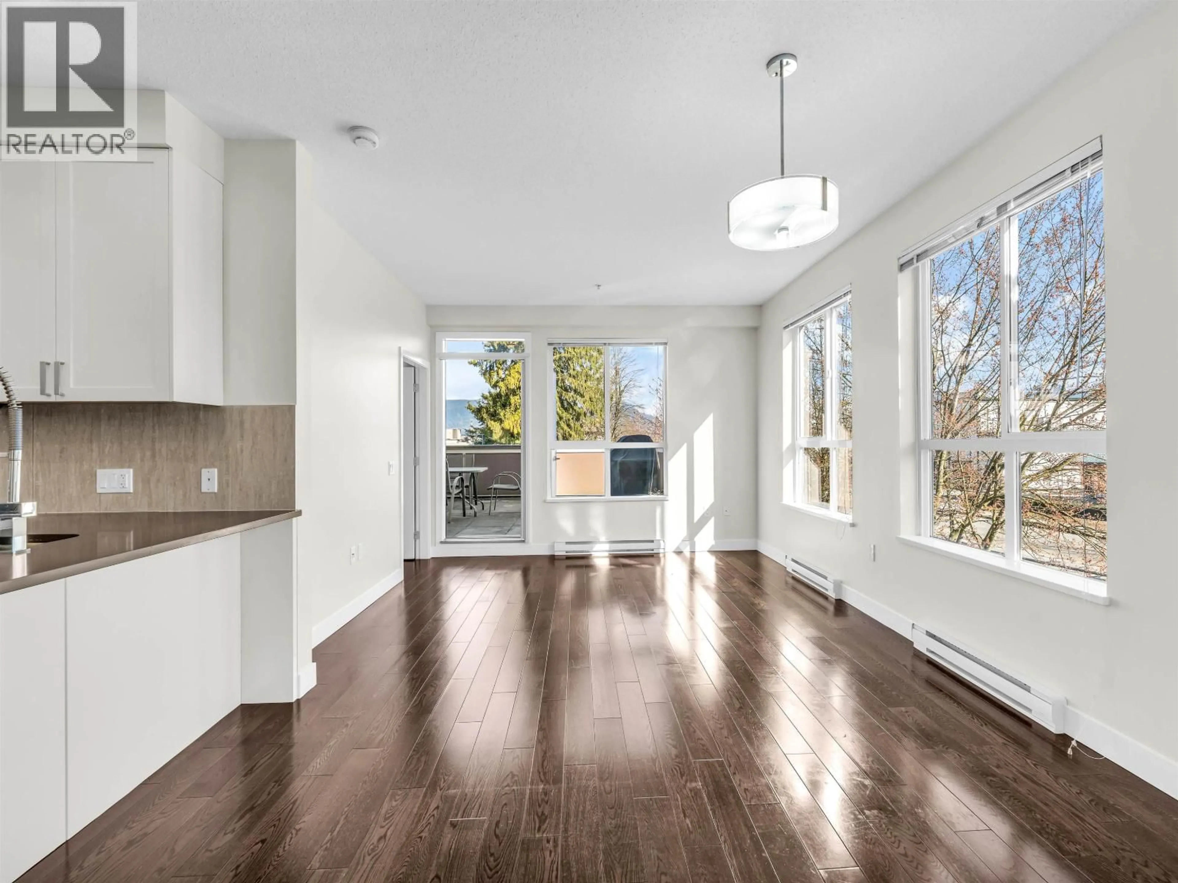 Open concept kitchen, wood/laminate floor for 205 - 12409 HARRIS ROAD, Pitt Meadows British Columbia V3Y0E7