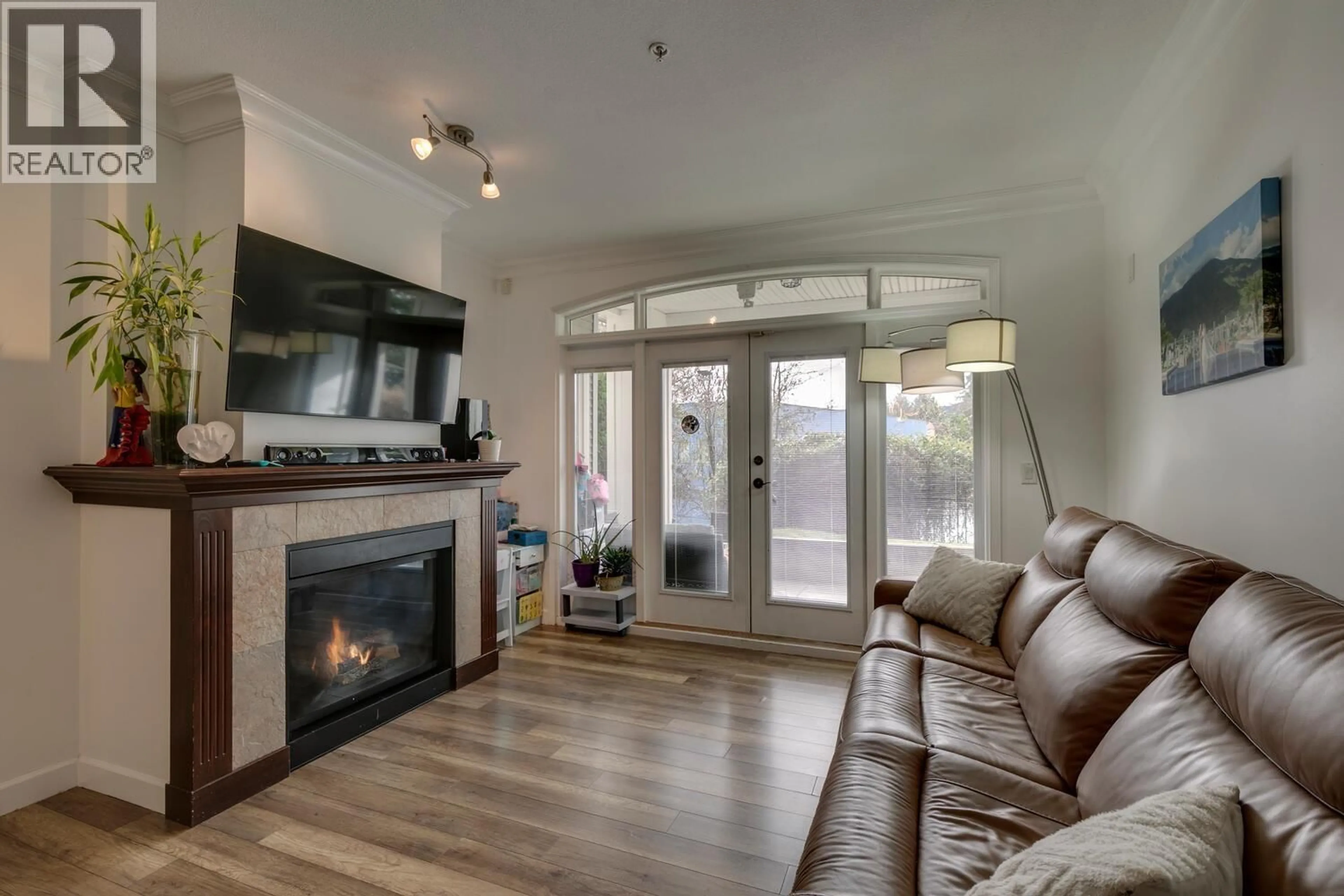 Living room with furniture, wood/laminate floor for 107 - 976 ADAIR AVENUE, Coquitlam British Columbia V3K3V2