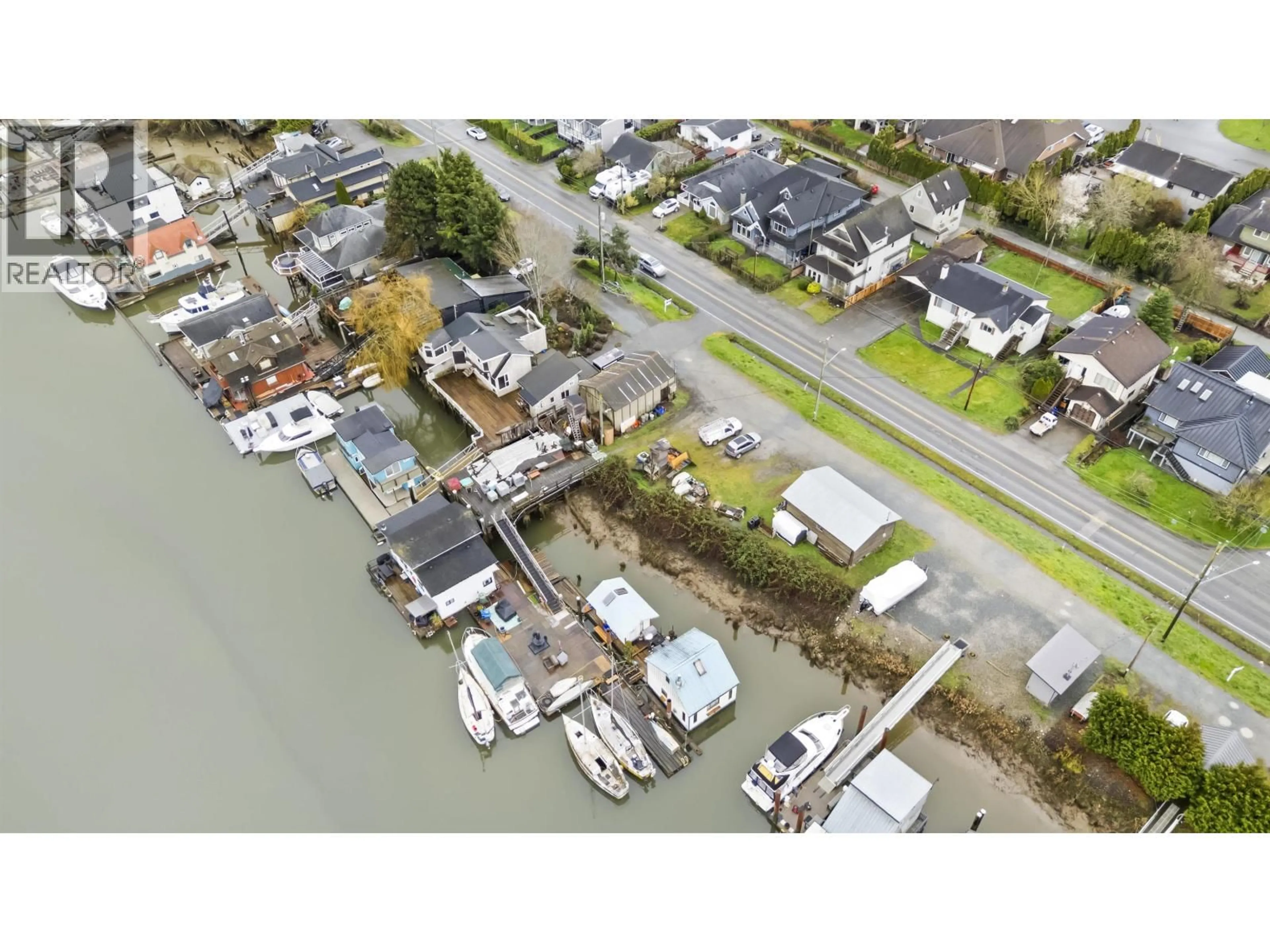 A pic from outside/outdoor area/front of a property/back of a property/a pic from drone, water/lake/river/ocean view for 4505 RIVER ROAD, Delta British Columbia V4K1R9