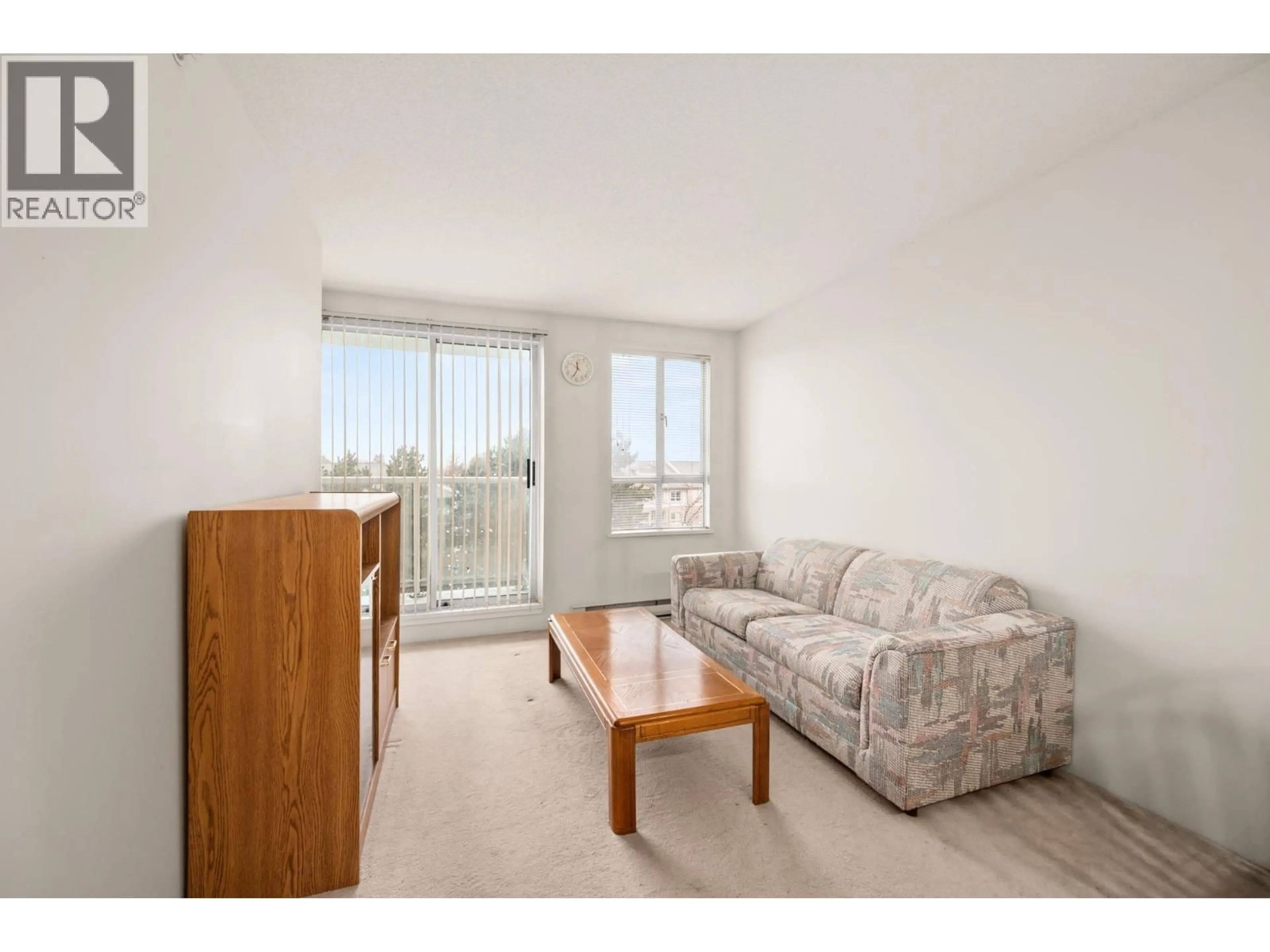Living room with furniture, wood/laminate floor for 607 - 3489 ASCOT PLACE, Vancouver British Columbia V5R6B6