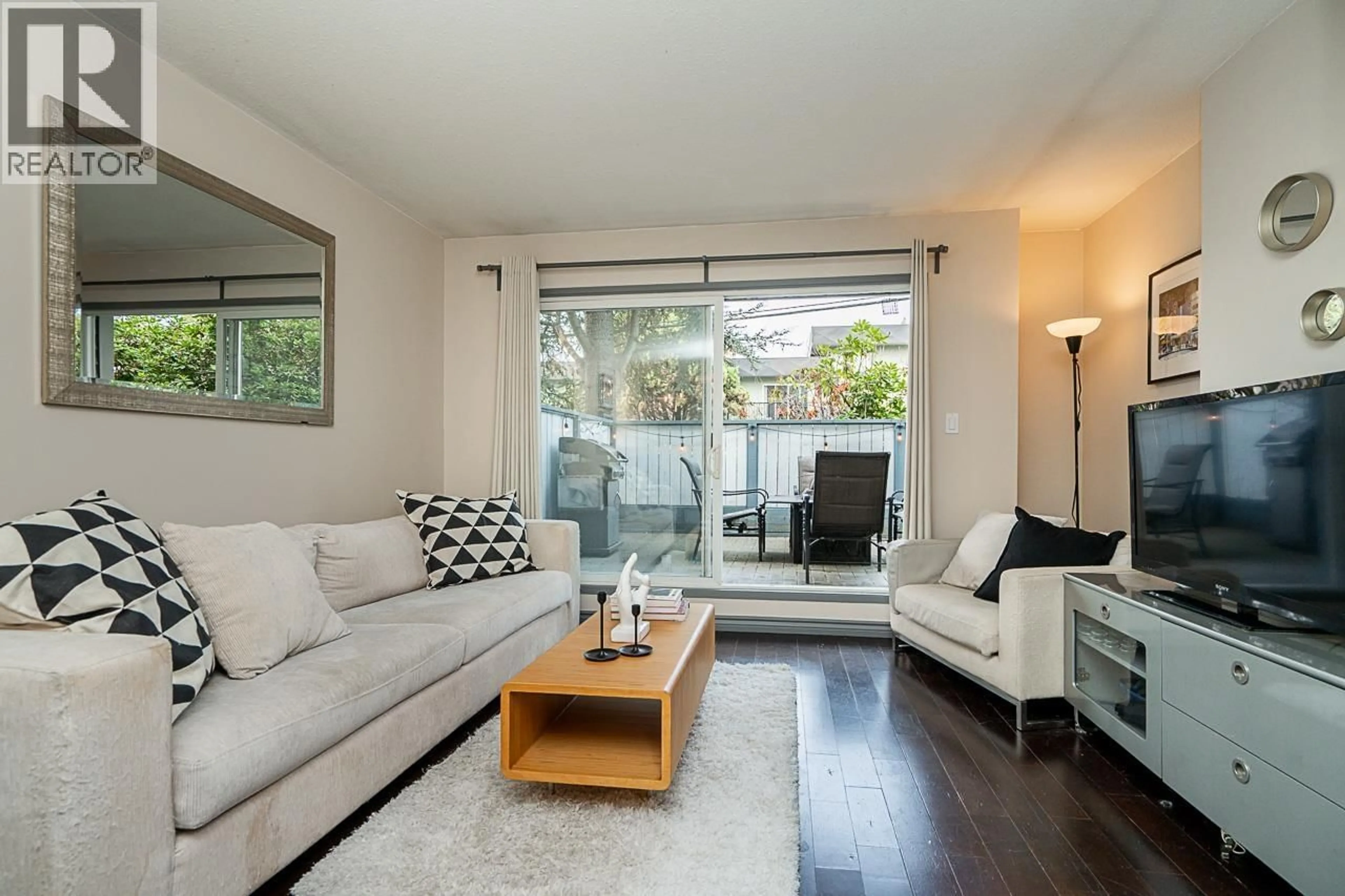 Living room with furniture, wood/laminate floor for 105 - 2255 ETON STREET, Vancouver British Columbia V5L1C9
