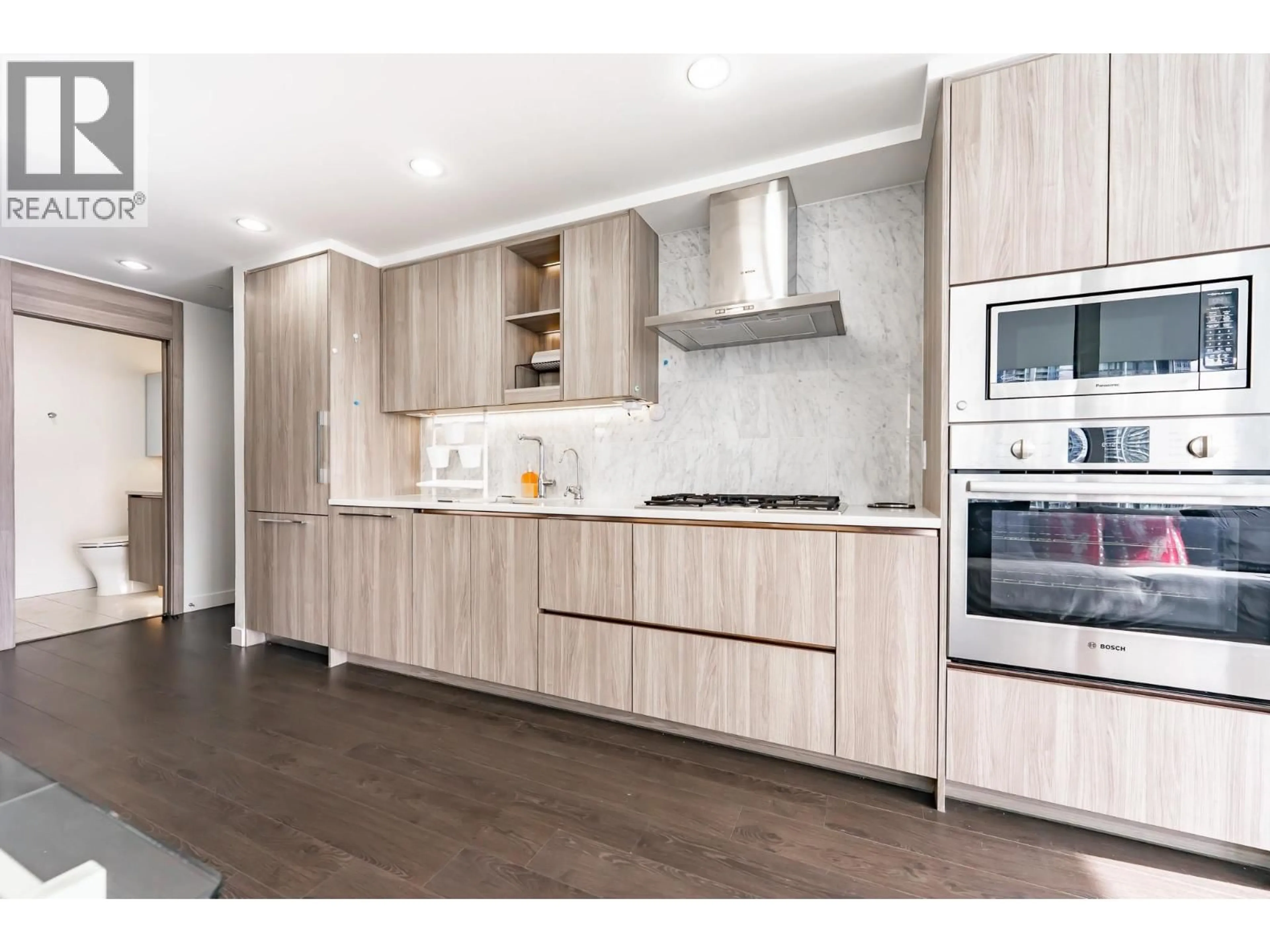 Open concept kitchen, wood/laminate floor for 802 - 4730 LOUGHEED HIGHWAY, Burnaby British Columbia V5C0M9