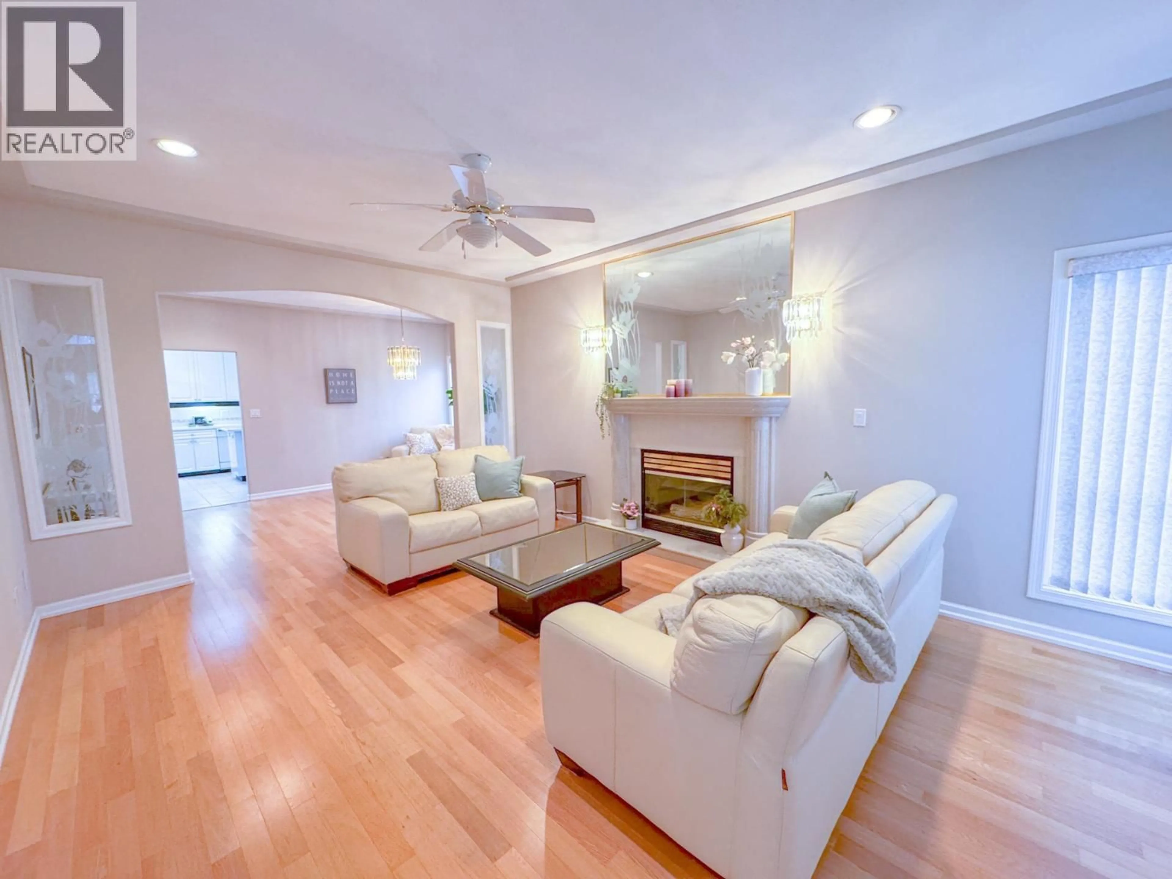 Living room with furniture, wood/laminate floor for 10675 MCKESSOCK PLACE, Richmond British Columbia V6X3Y3