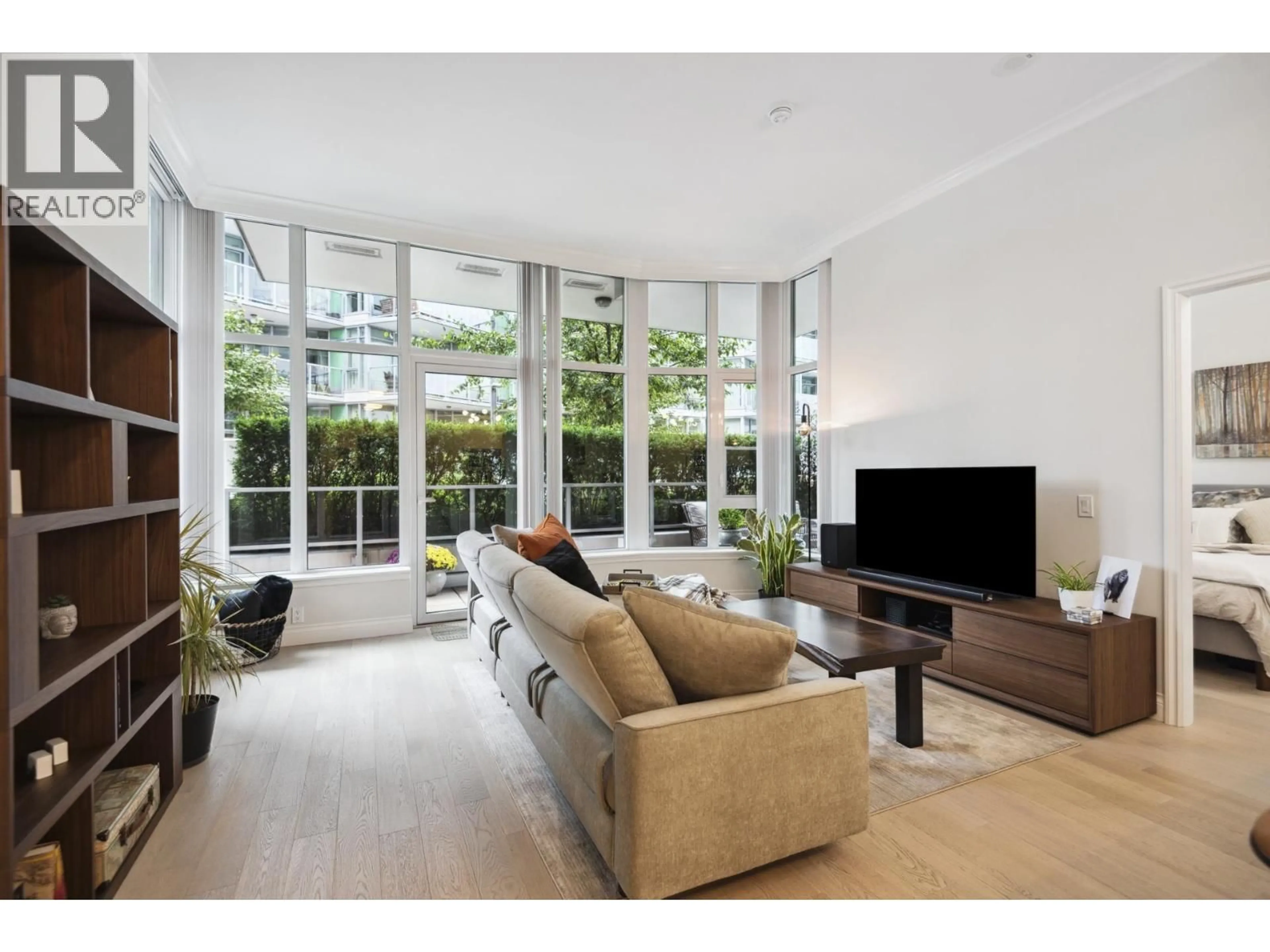 Living room with furniture, unknown for 112 - 185 VICTORY SHIP WAY, North Vancouver British Columbia V7L0G2