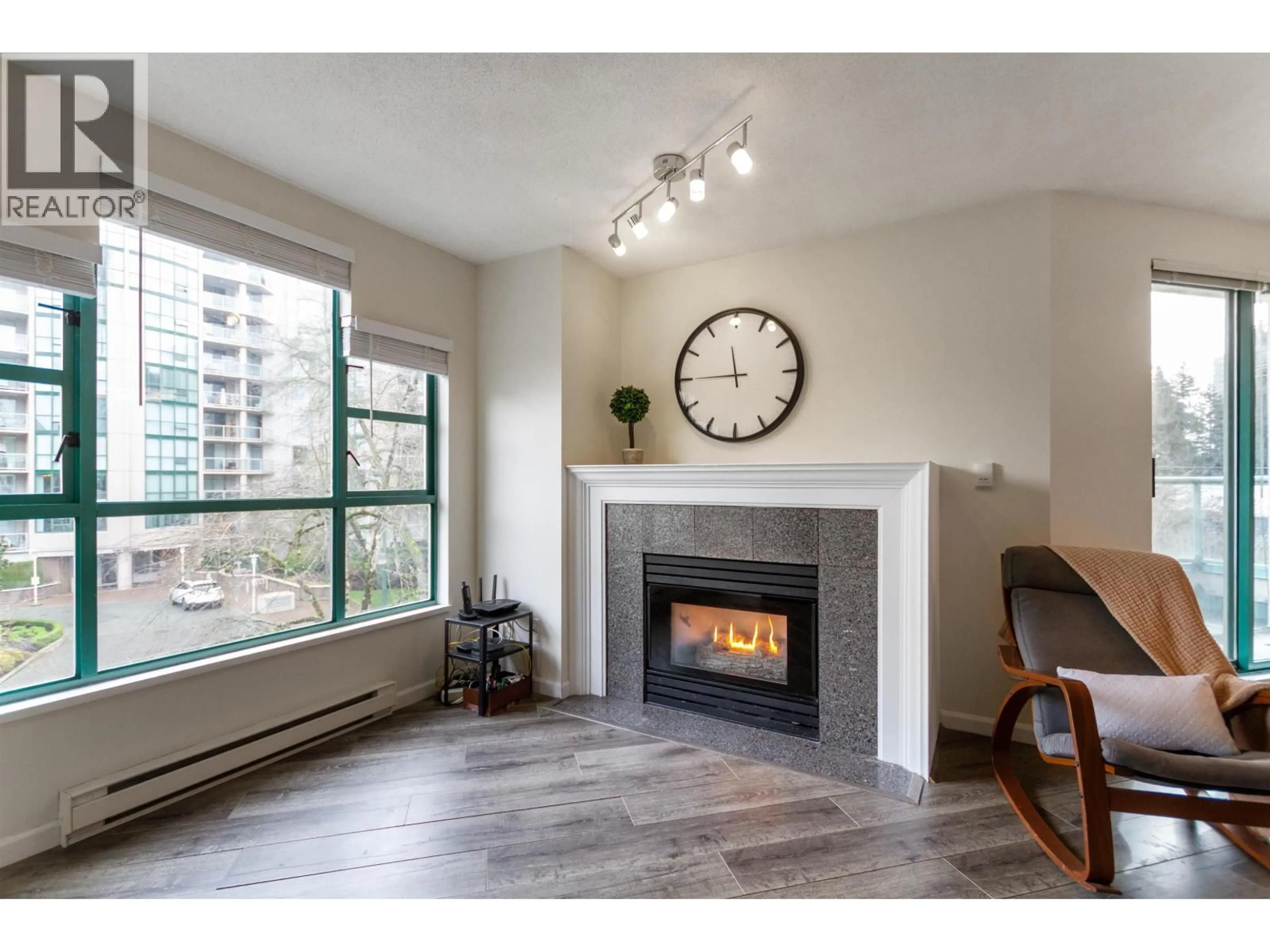 Living room with furniture, wood/laminate floor for 401E - 3081 GLEN DRIVE, Coquitlam British Columbia V3B2P8