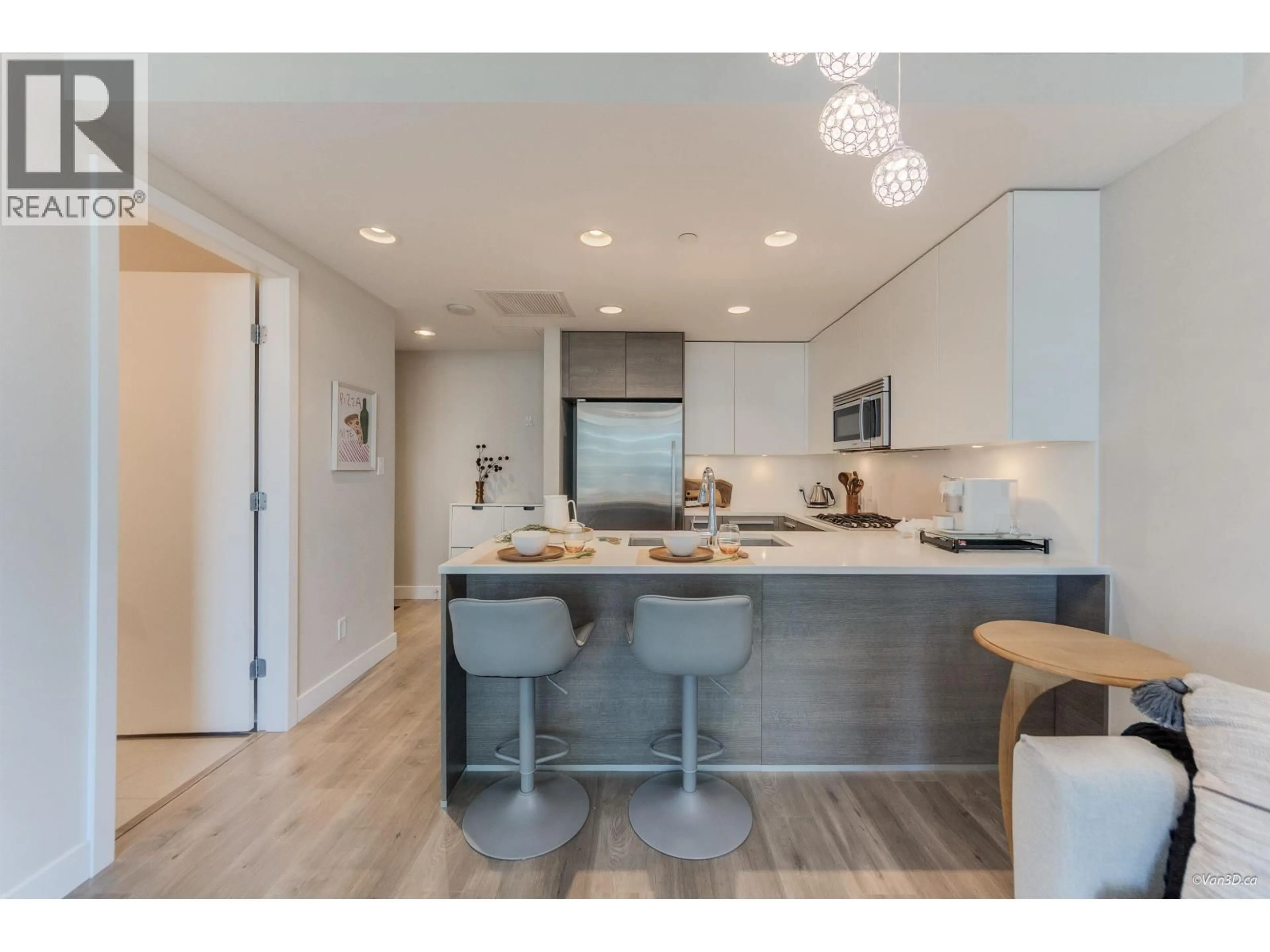 Open concept kitchen, wood/laminate floor for 706 - 2008 ROSSER AVENUE, Burnaby British Columbia V5C0H8