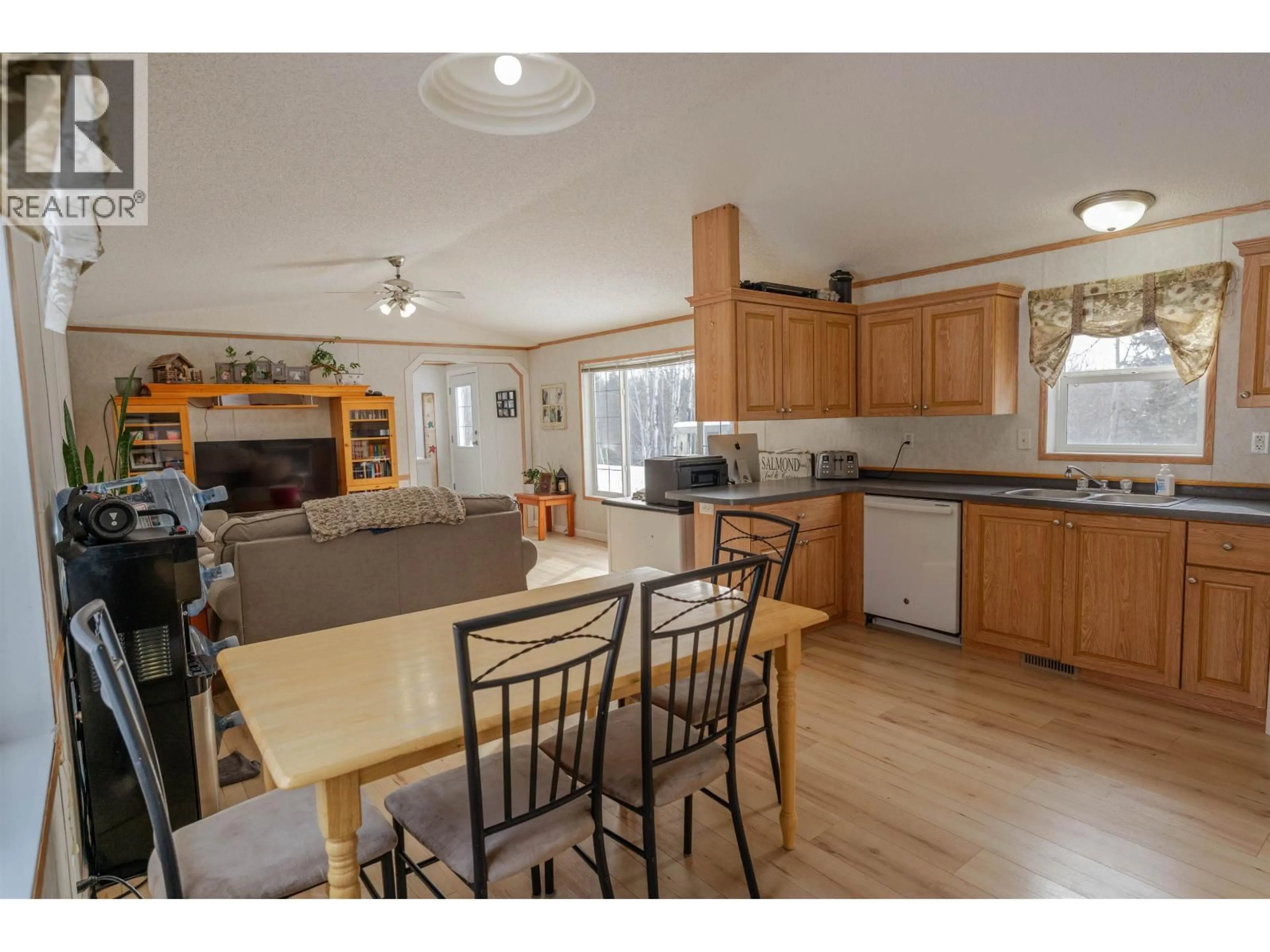 Open concept kitchen, wood/laminate floor for 13619 283 ROAD, Fort St. John British Columbia V1J4M7
