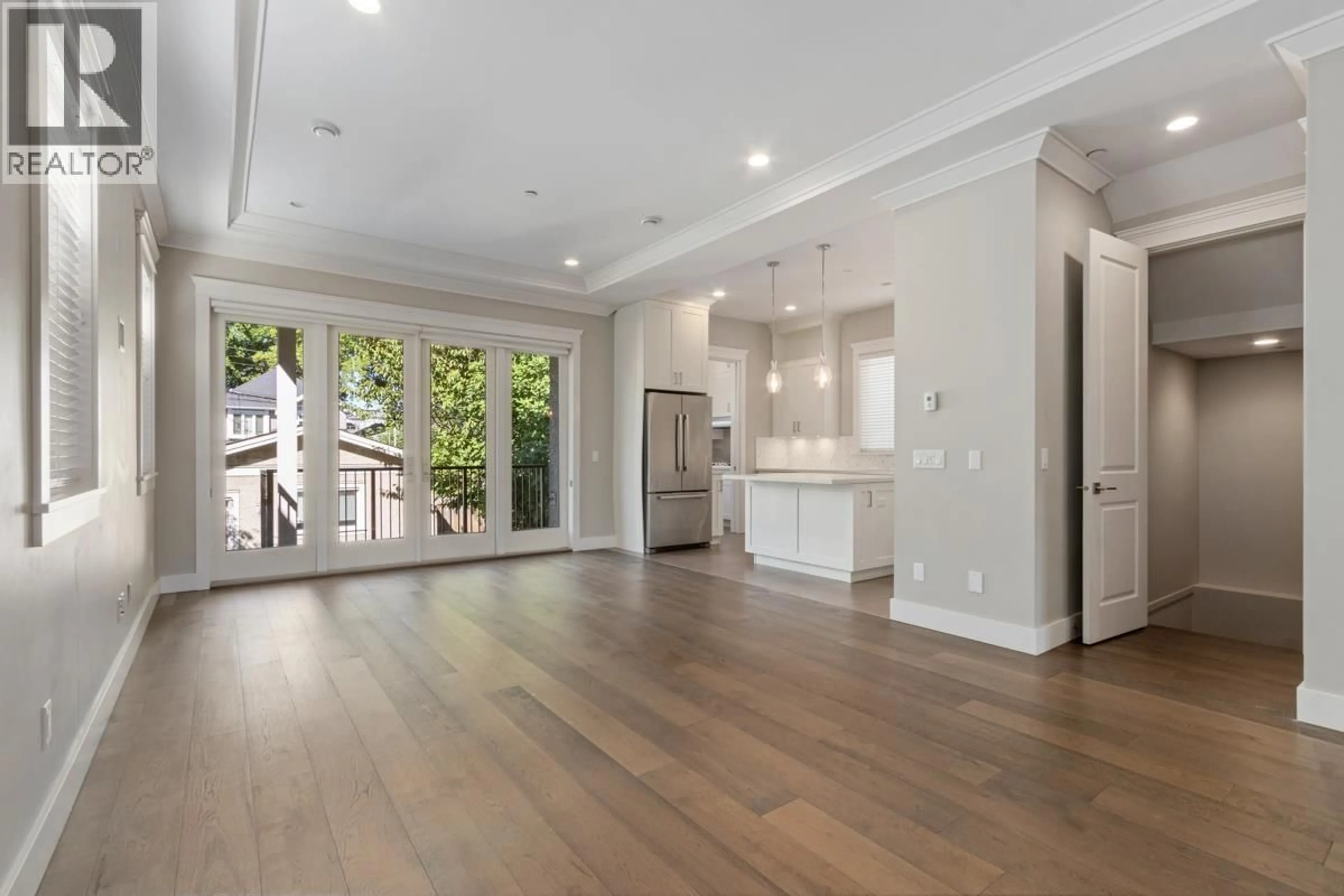 Open concept kitchen, wood/laminate floor for 3443 11TH AVENUE, Vancouver British Columbia V6R2K1