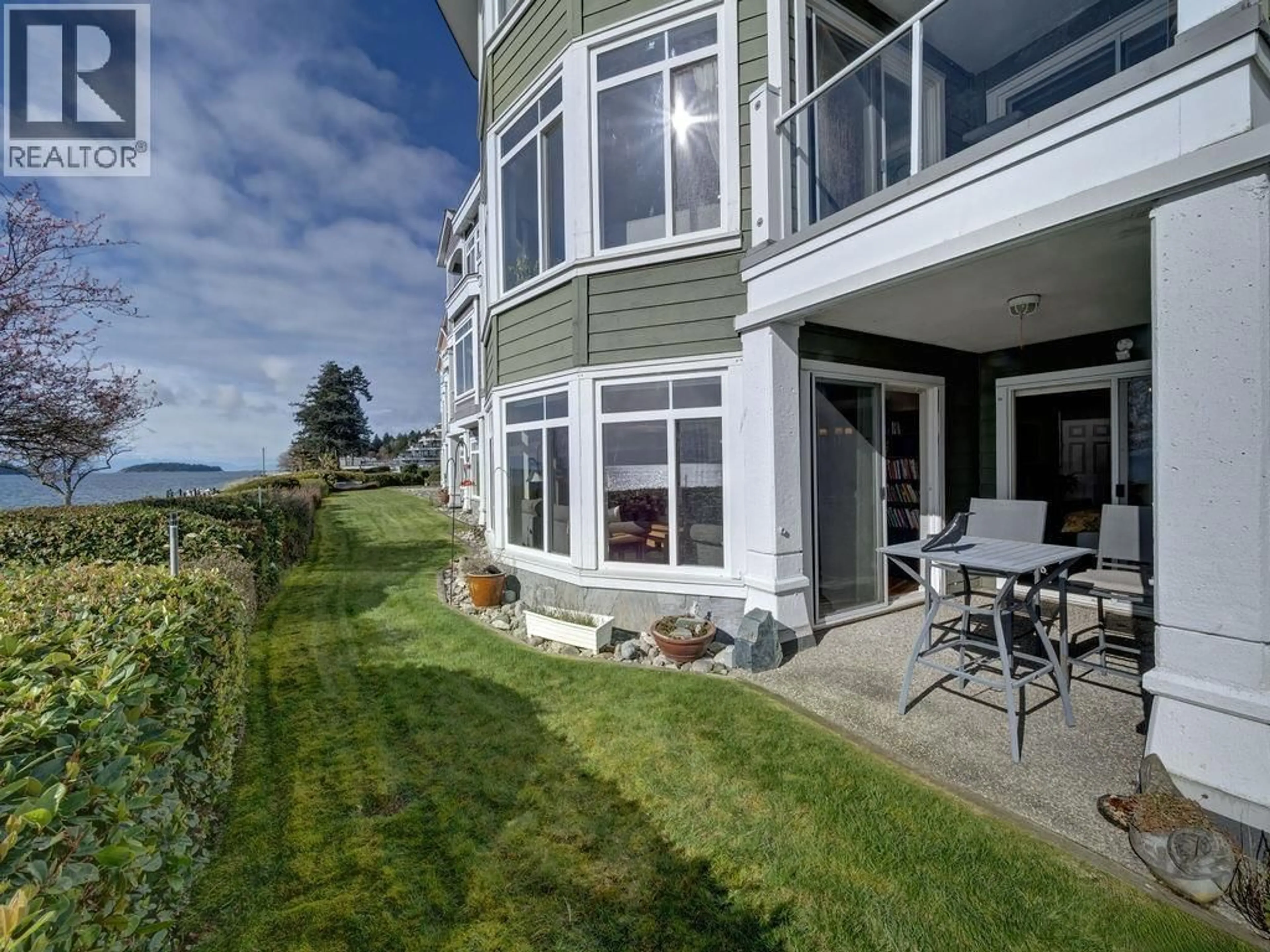 A pic from outside/outdoor area/front of a property/back of a property/a pic from drone, water/lake/river/ocean view for 103 - 5470 INLET AVENUE, Sechelt British Columbia V7Z0H4