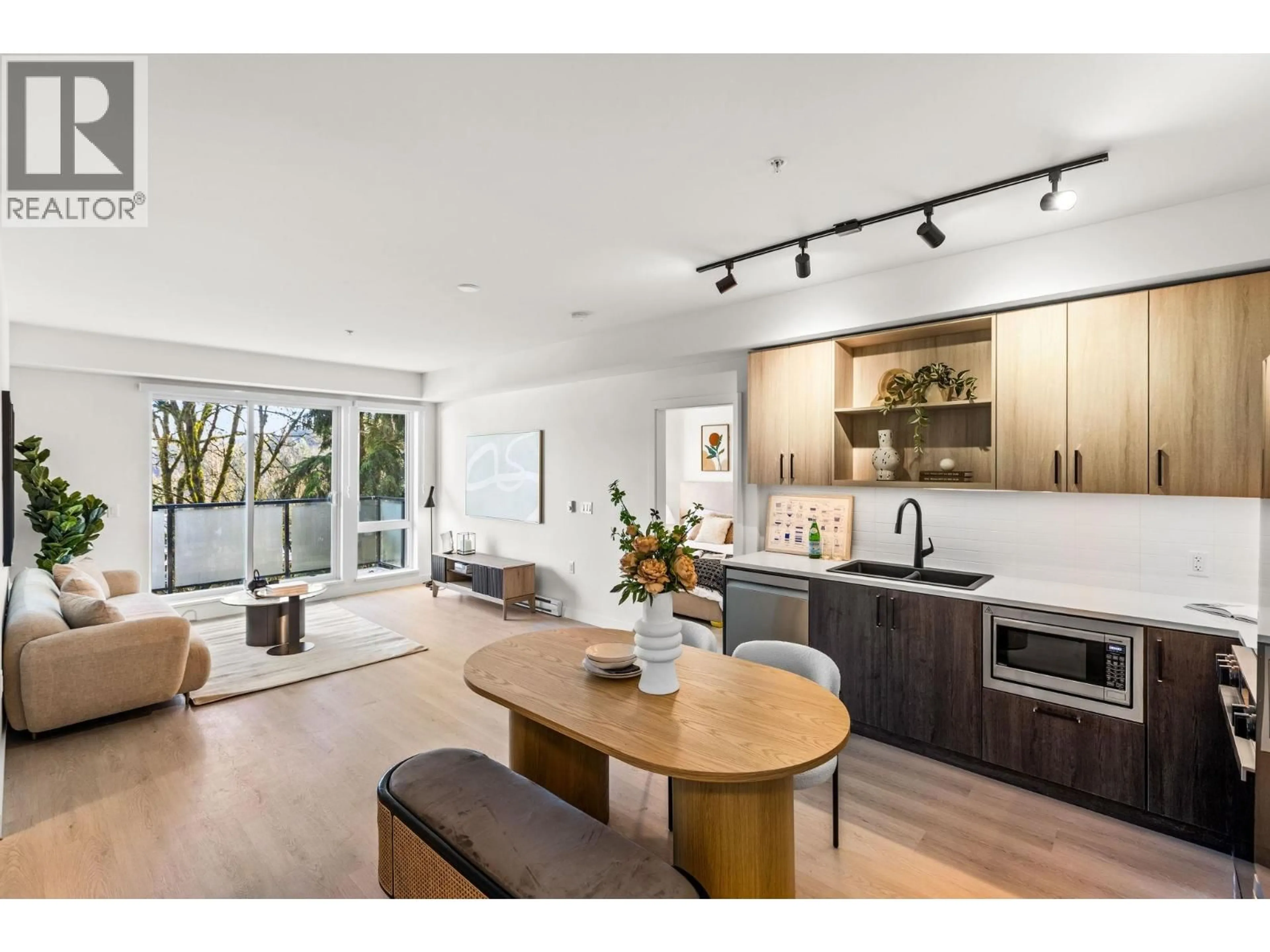 Open concept kitchen, wood/laminate floor for 407 - 2002 ST. GEORGE STREET, Port Moody British Columbia V3H0N4