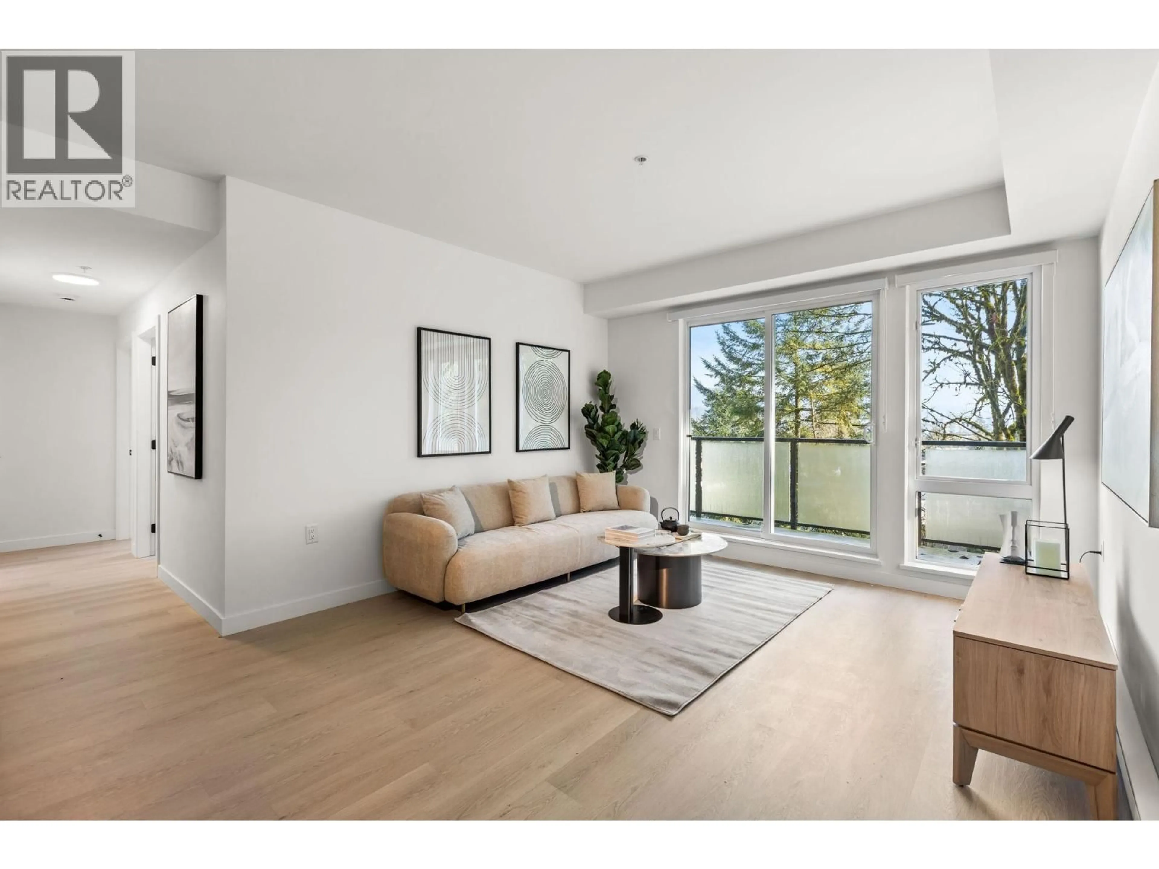 Living room with furniture, wood/laminate floor for 407 - 2002 ST. GEORGE STREET, Port Moody British Columbia V3H0N4