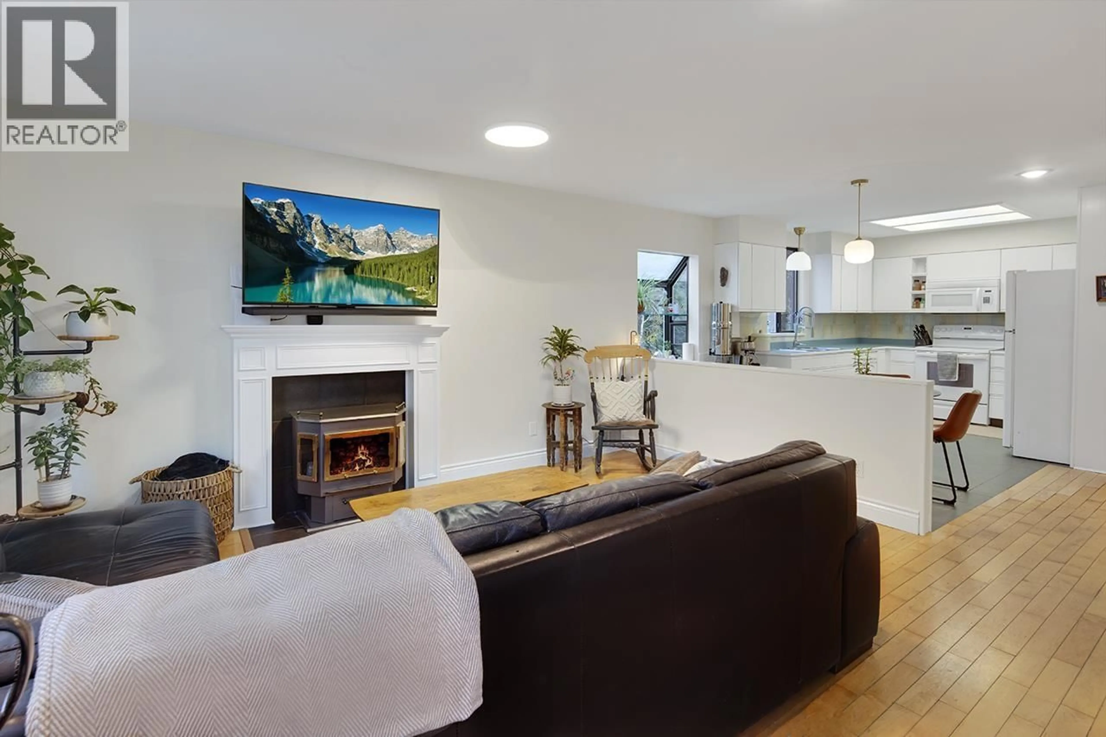 Living room with furniture, wood/laminate floor for 1736 LANGAN AVENUE, Port Coquitlam British Columbia V3C1K7