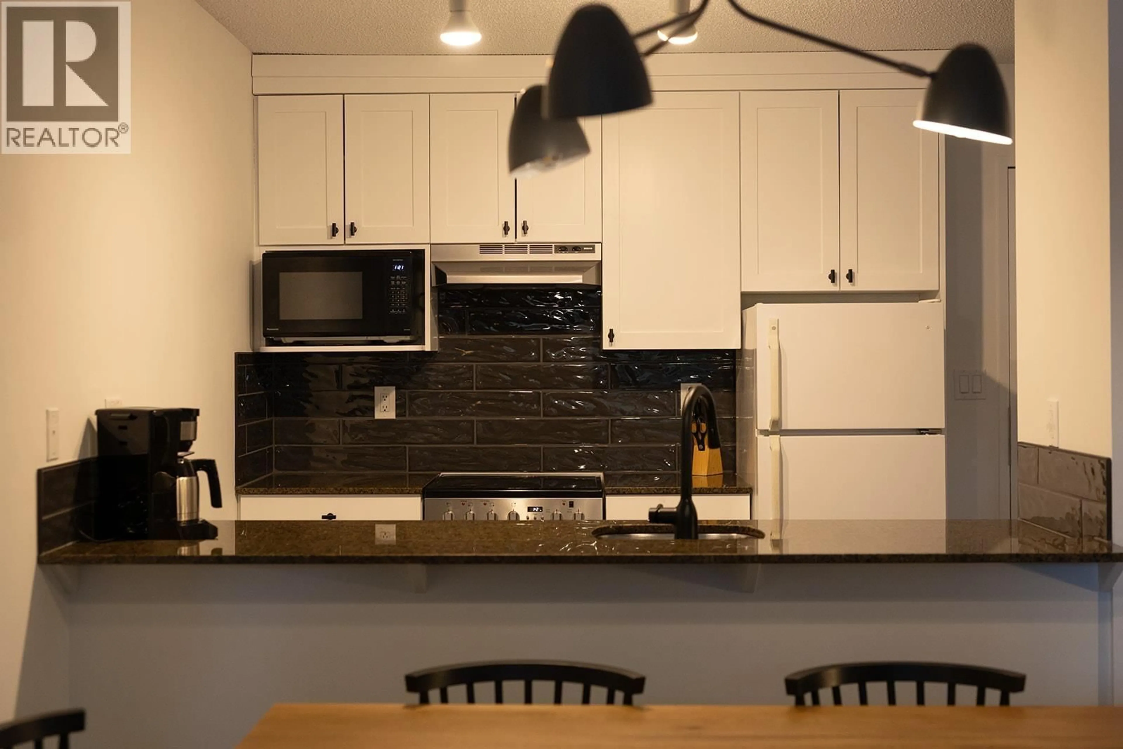 Open concept kitchen, unknown for 208 - 4200 WHISTLER WAY, Whistler British Columbia V8E1J4