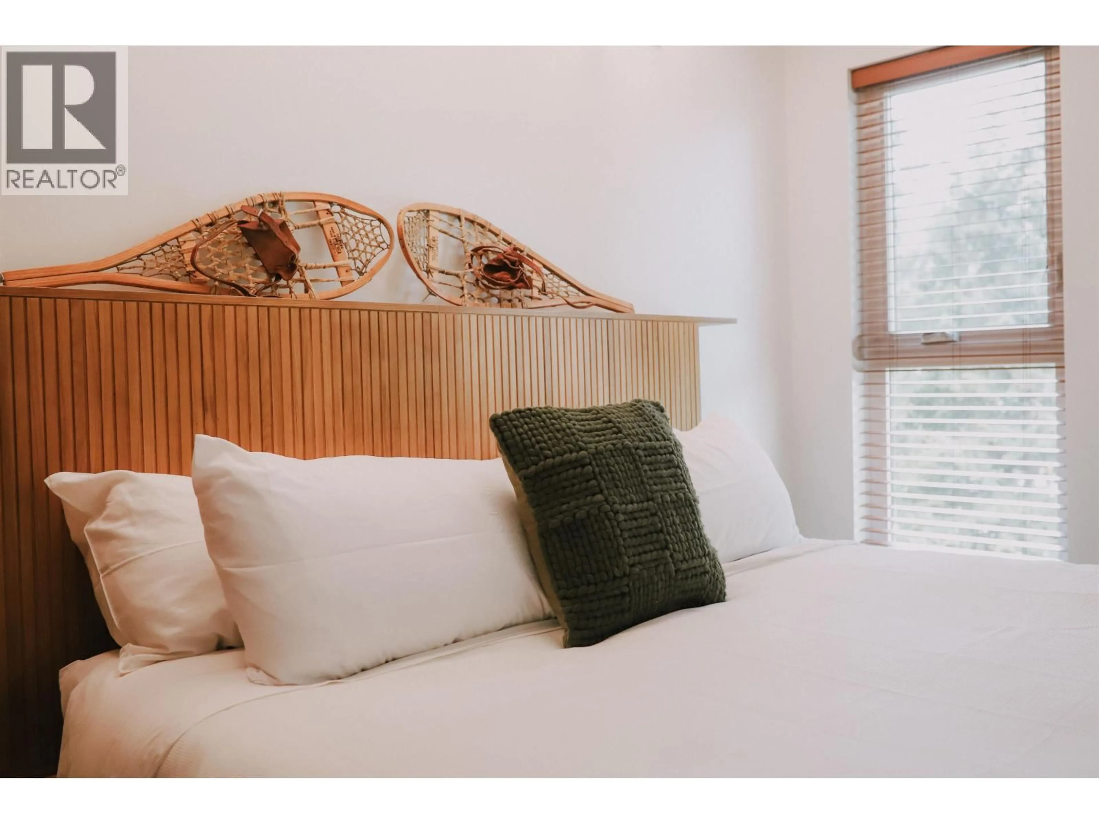 Bedroom with bed, wood/laminate floor for 208 - 4200 WHISTLER WAY, Whistler British Columbia V8E1J4