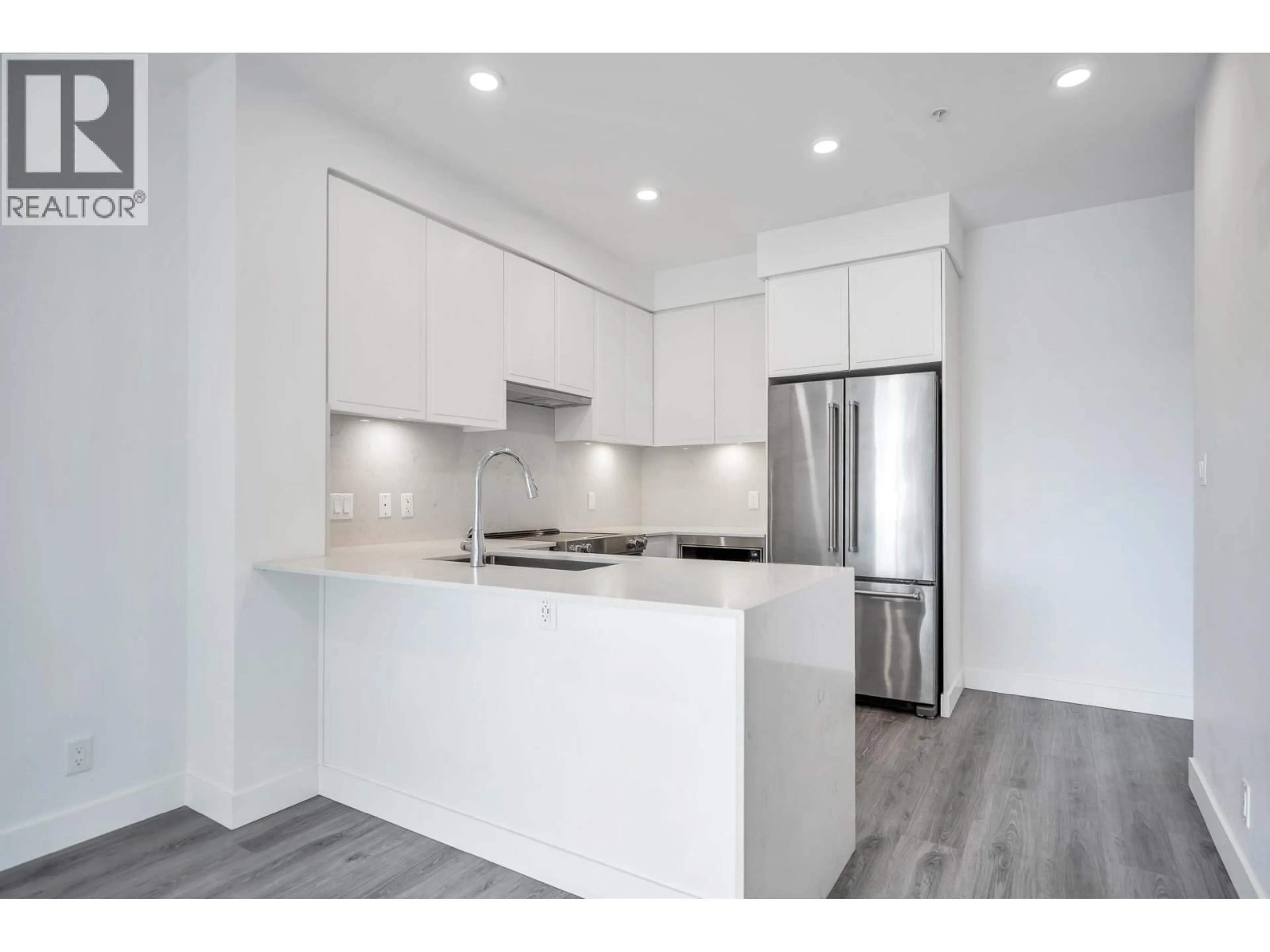 Open concept kitchen, wood/laminate floor for 503 - 700 CLARKE ROAD, Coquitlam British Columbia V3J0K5