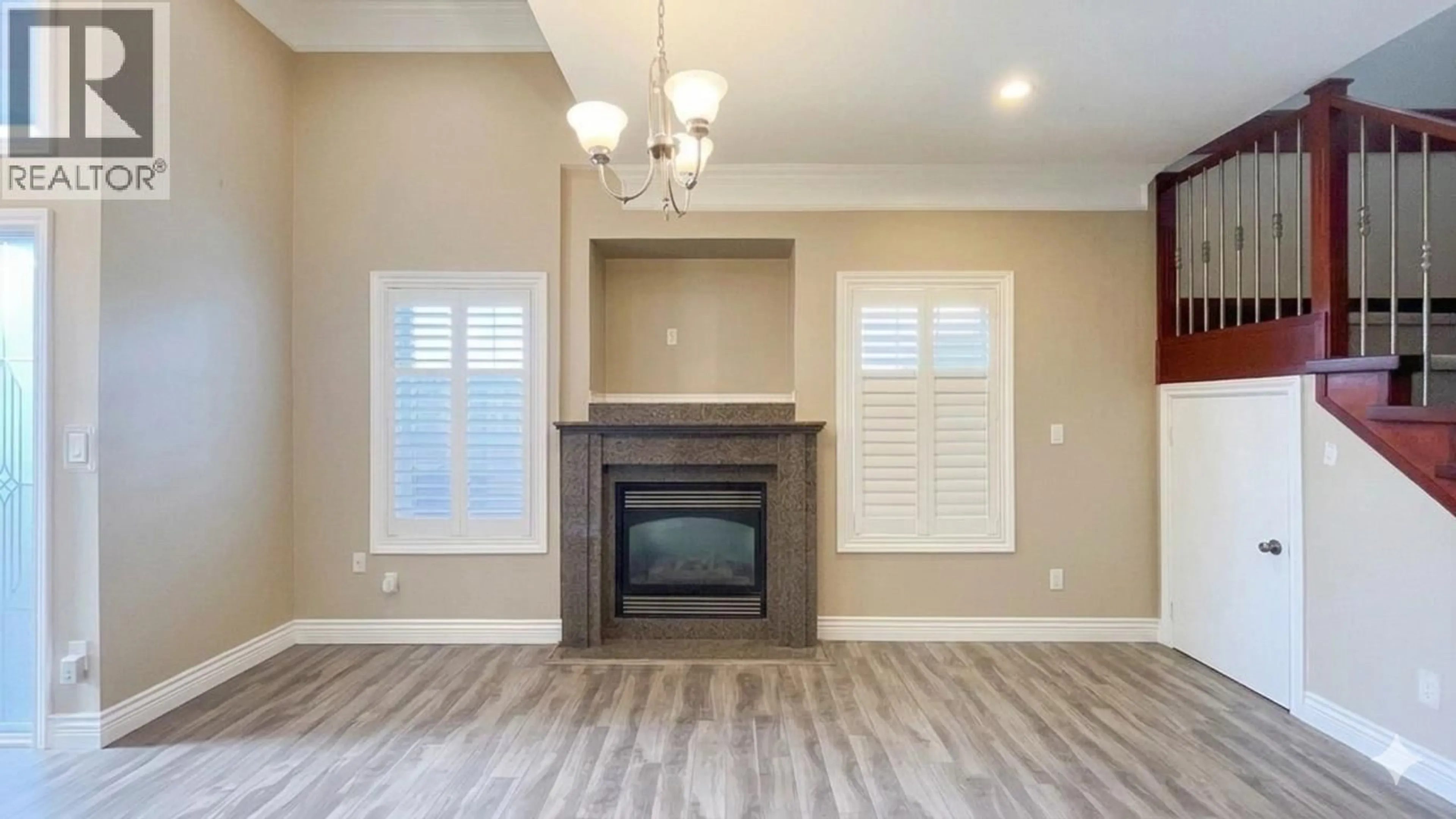 Living room with furniture, wood/laminate floor for 6916 CUNNINGHAM COURT, Burnaby British Columbia V5E0B1