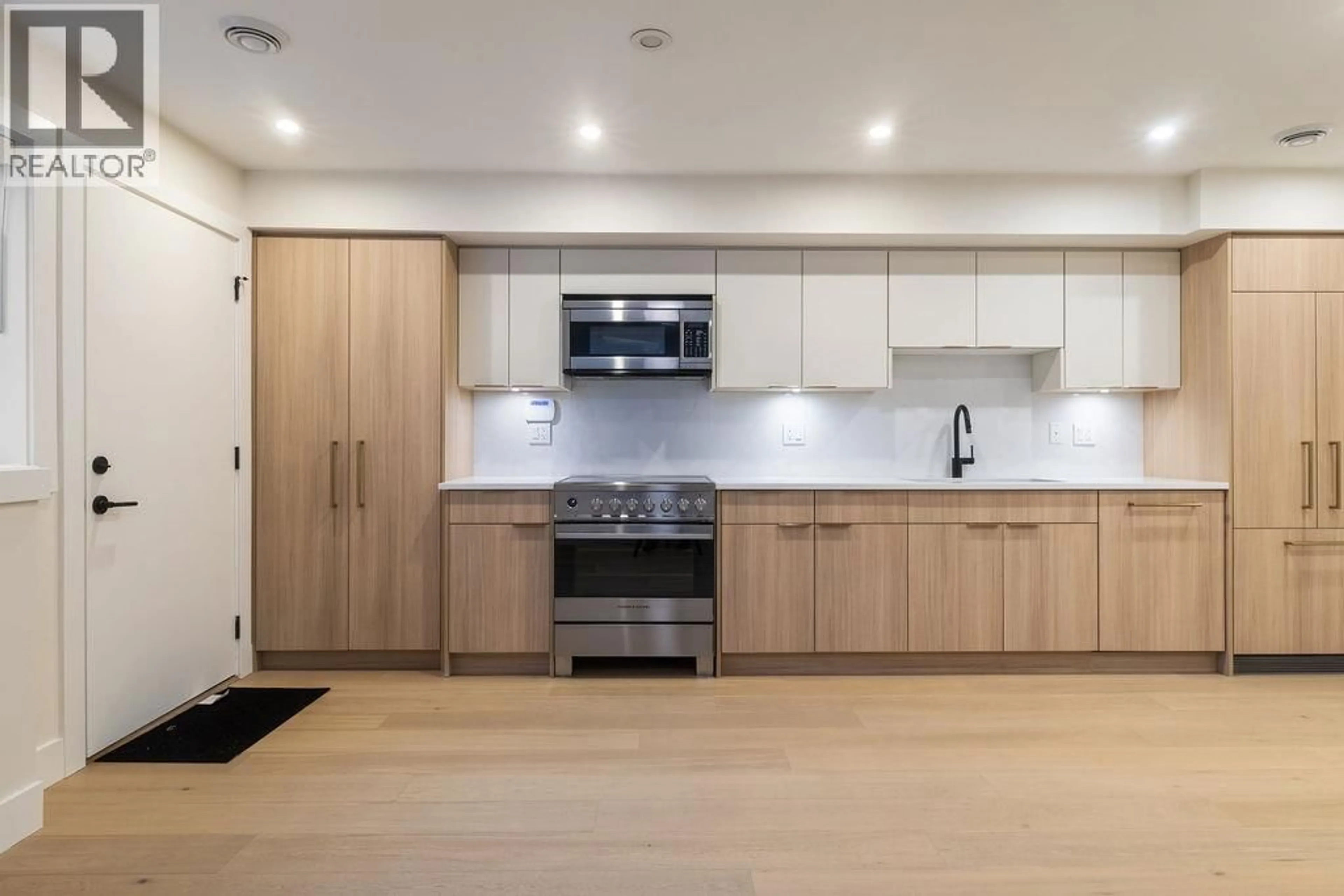 Open concept kitchen, wood/laminate floor for 1 - 1933 TEMPLETON DRIVE, Vancouver British Columbia V5N4V9