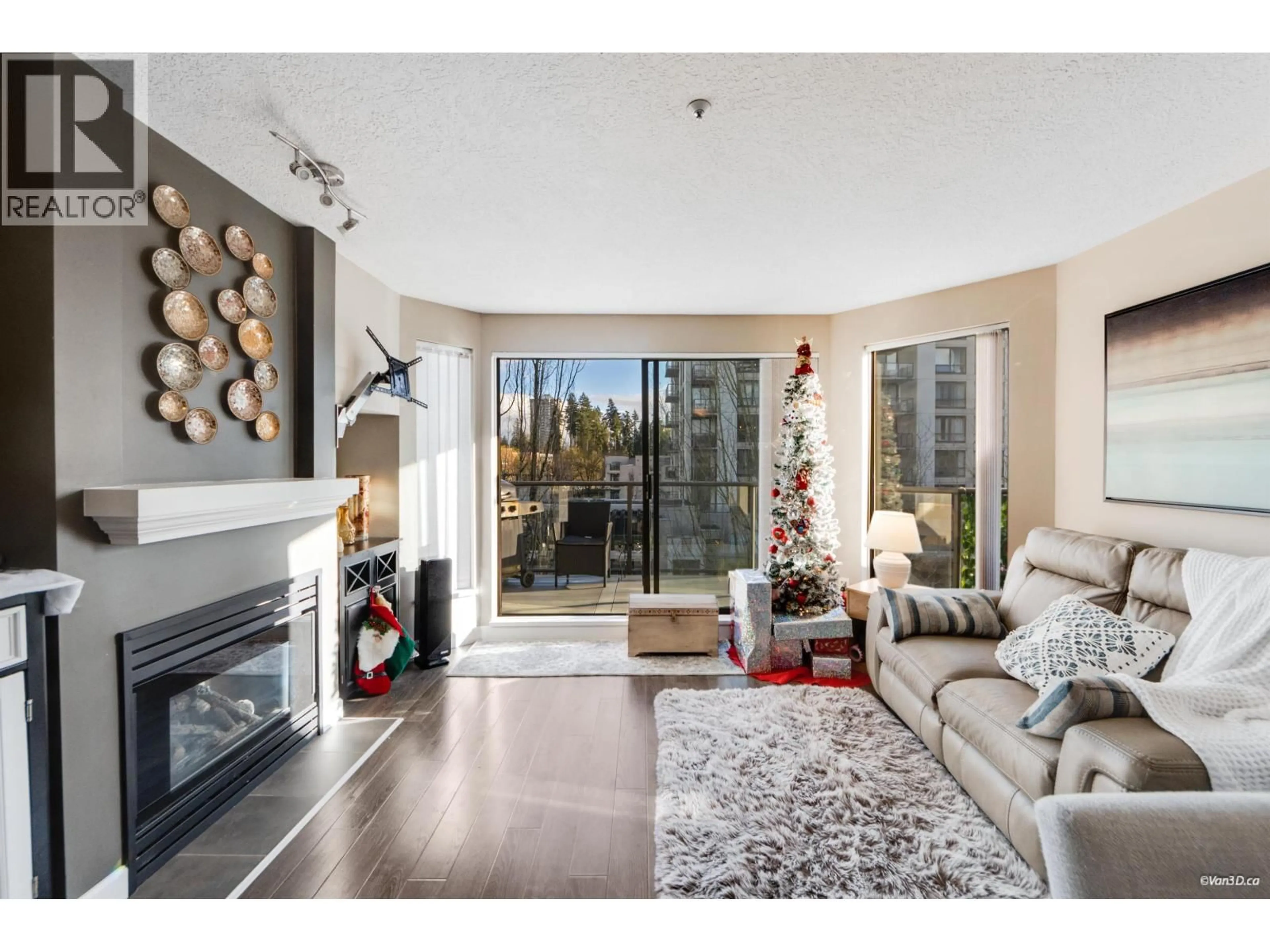 Living room with furniture, wood/laminate floor for 415 - 2978 BURLINGTON DRIVE, Coquitlam British Columbia V3B7S6