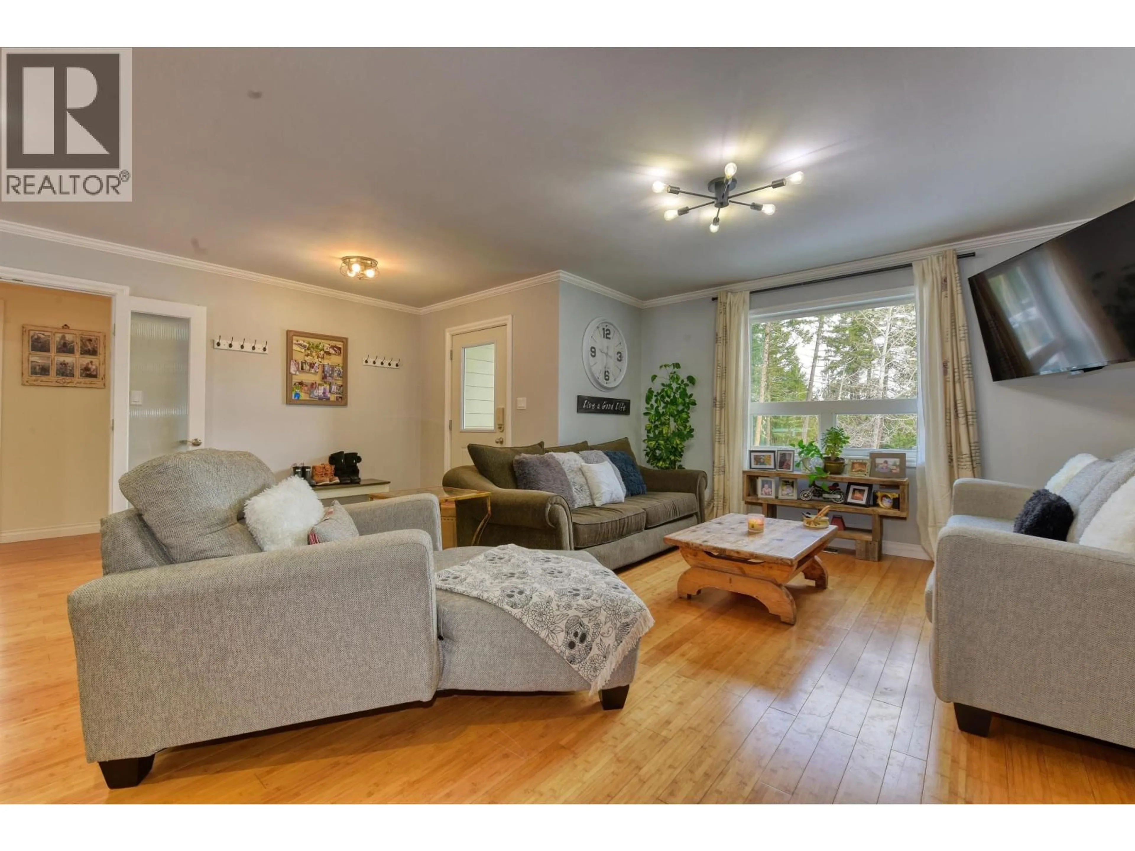 Living room with furniture, wood/laminate floor for 2031 MCPHERSON WYND, Williams Lake British Columbia V2G4V7