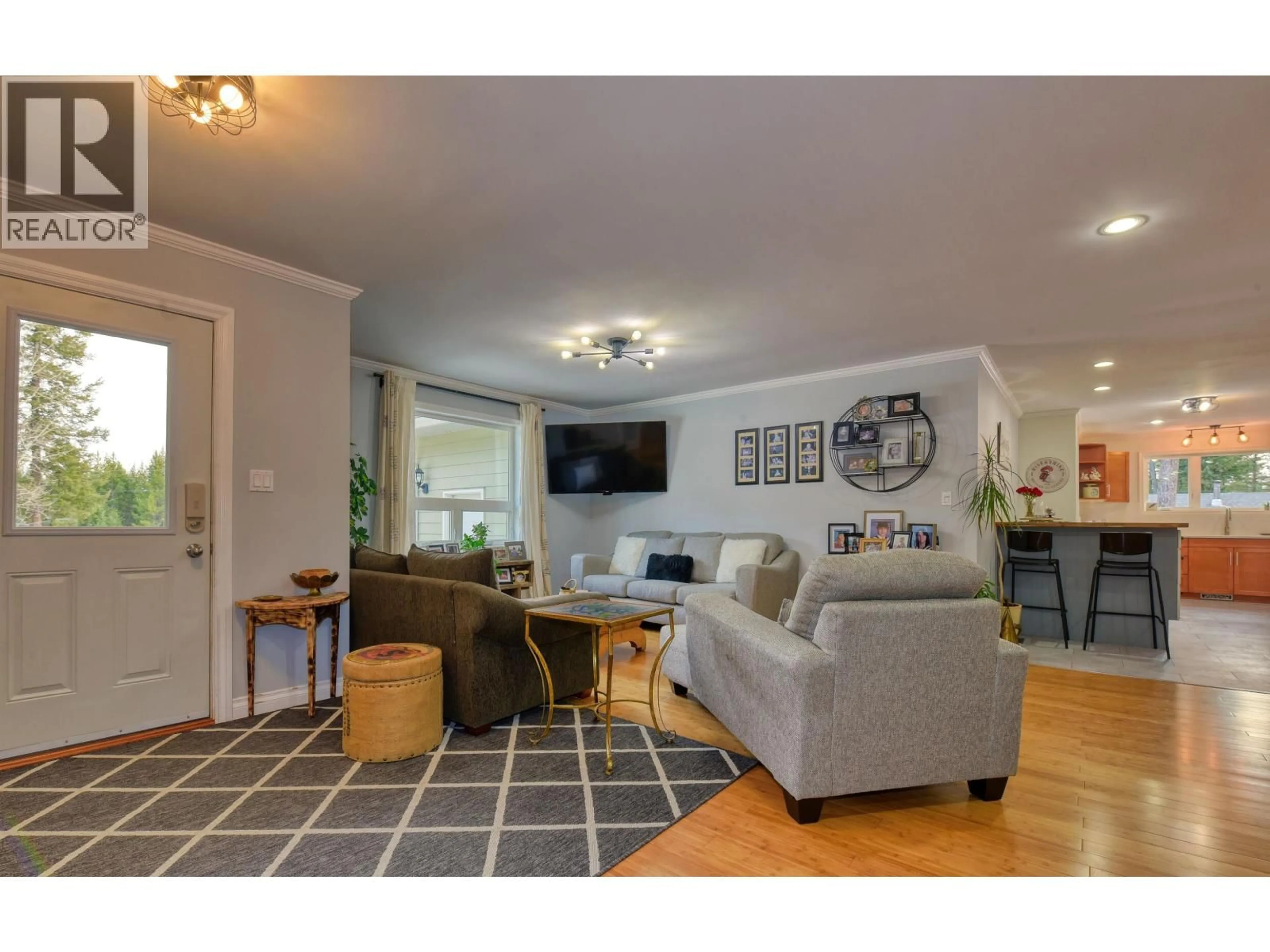 Living room with furniture, wood/laminate floor for 2031 MCPHERSON WYND, Williams Lake British Columbia V2G4V7