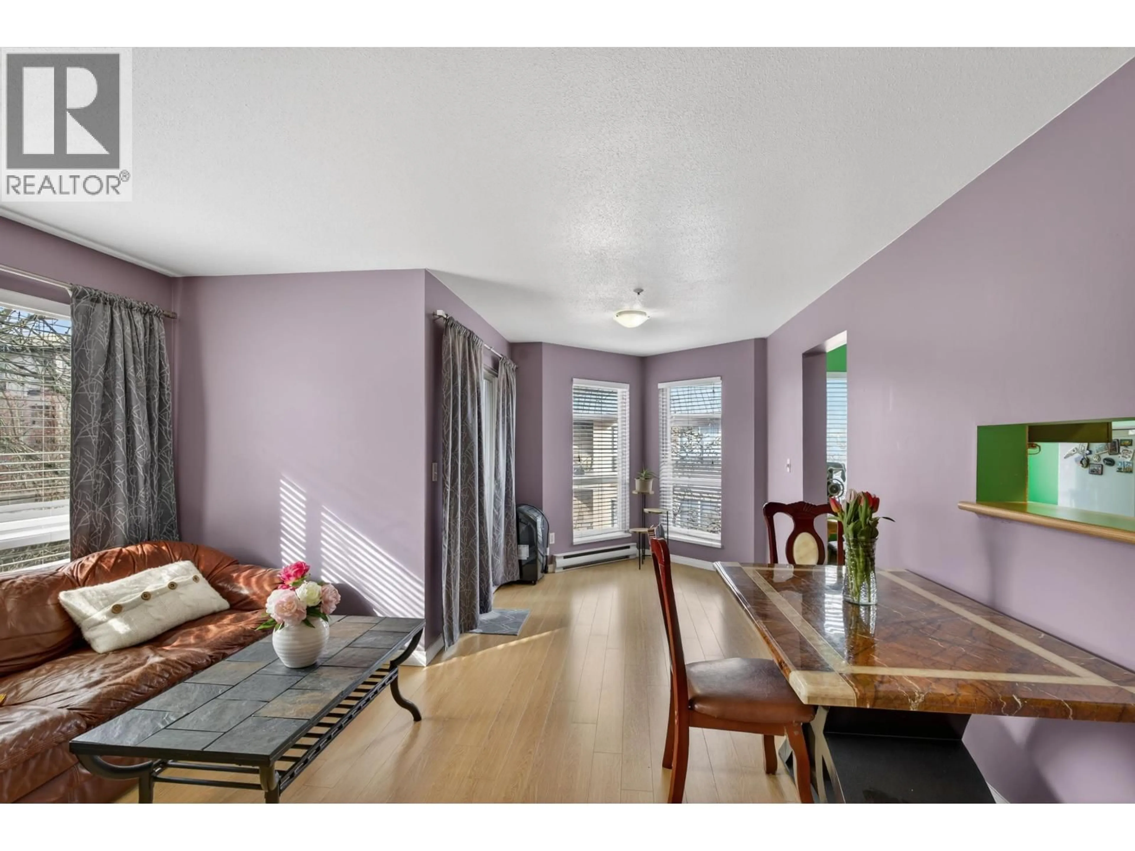 Living room with furniture, wood/laminate floor for 309 - 2435 WELCHER AVENUE, Port Coquitlam British Columbia V3C1X8