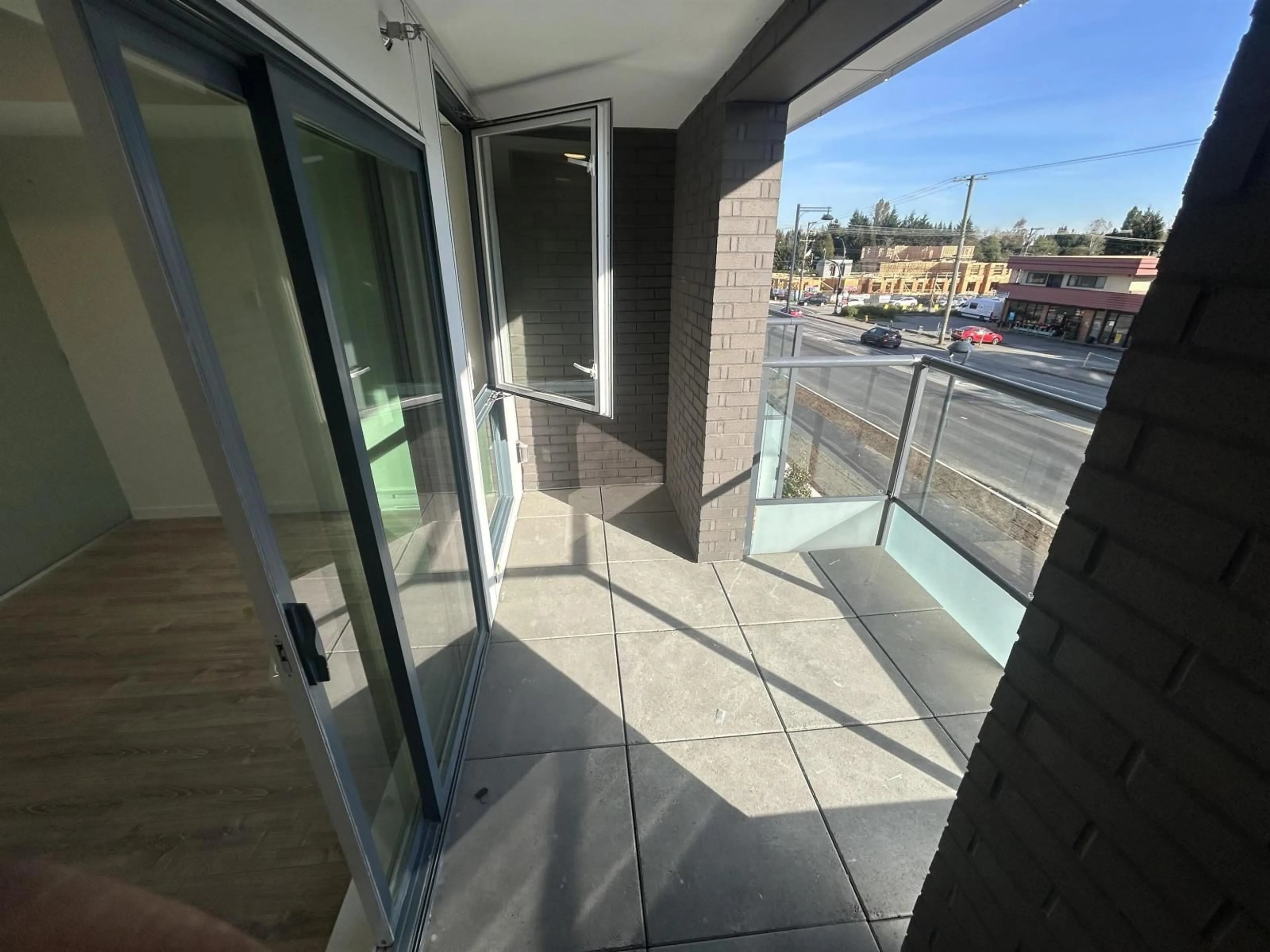 Balcony in the apartment, city buildings view from balcony for W212 - 10828 139A STREET, Surrey British Columbia V3R0H3