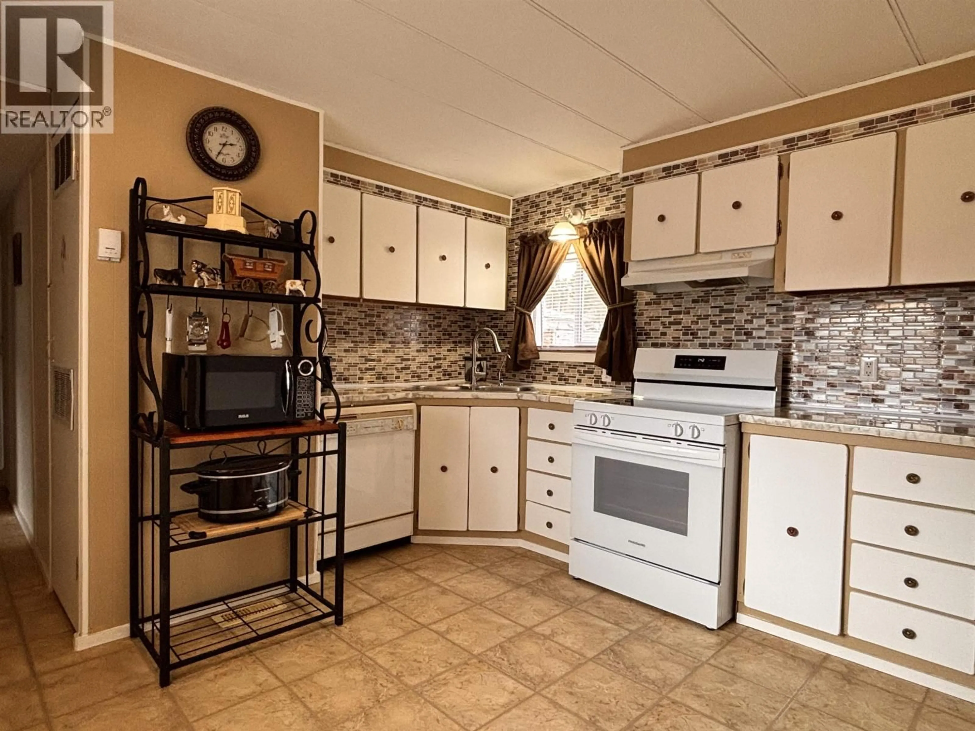 Standard kitchen, ceramic/tile floor for 5390 PARK DRIVE, 103 Mile House British Columbia V0K2E1