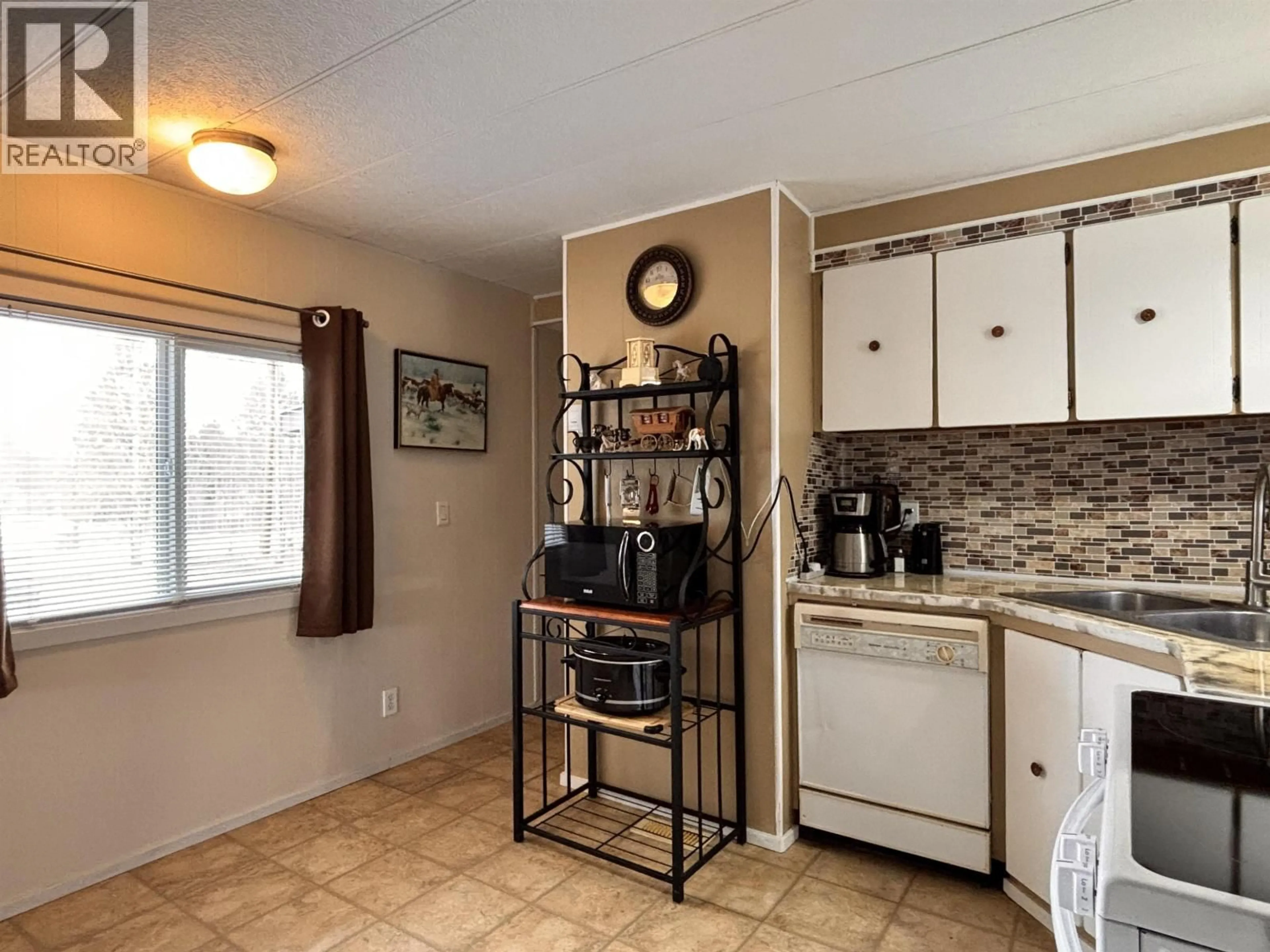 Standard kitchen, ceramic/tile floor for 5390 PARK DRIVE, 103 Mile House British Columbia V0K2E1