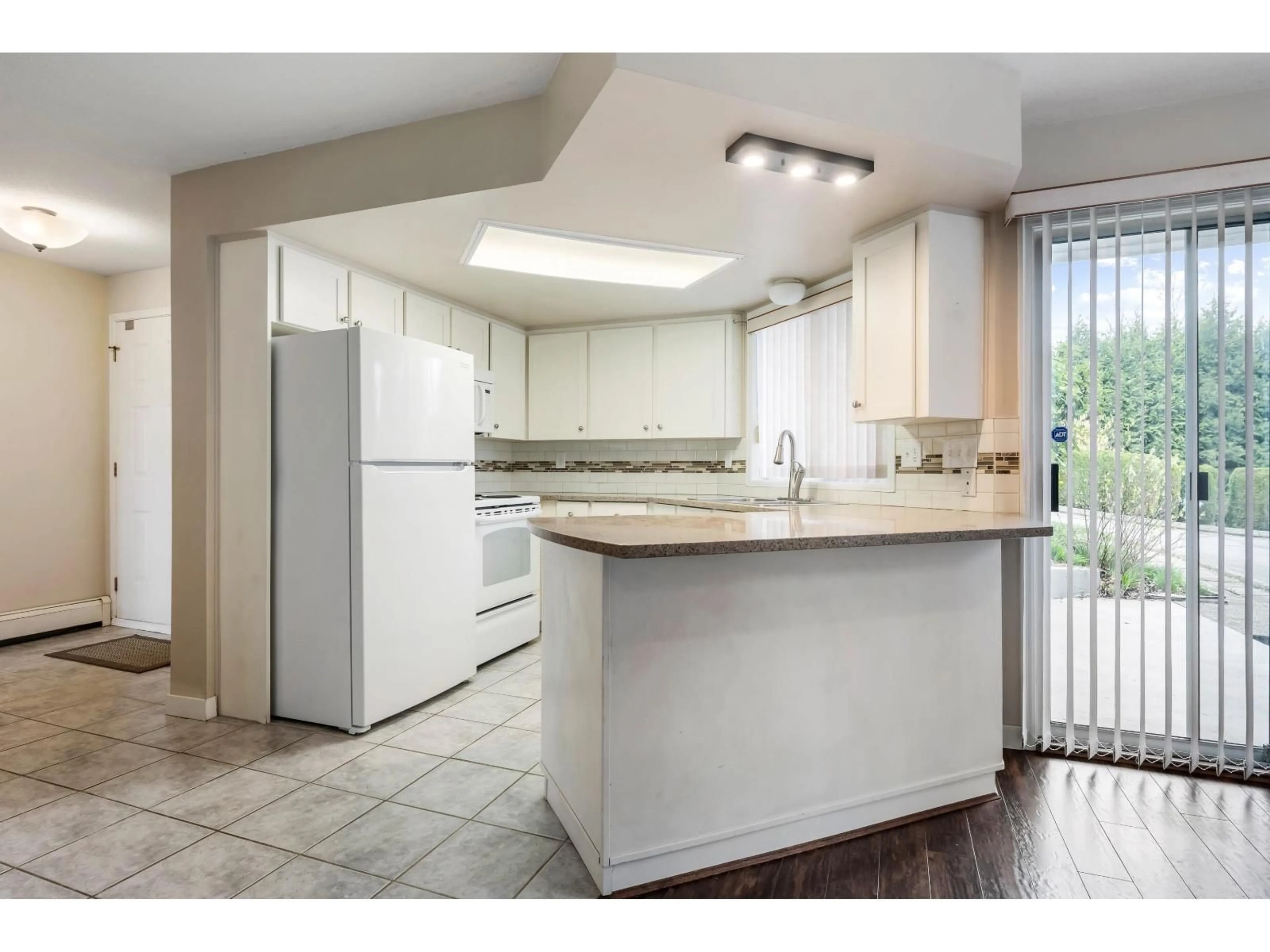 Open concept kitchen, ceramic/tile floor for 4 - 3632 BULKLEY STREET, Abbotsford British Columbia V3G3E9