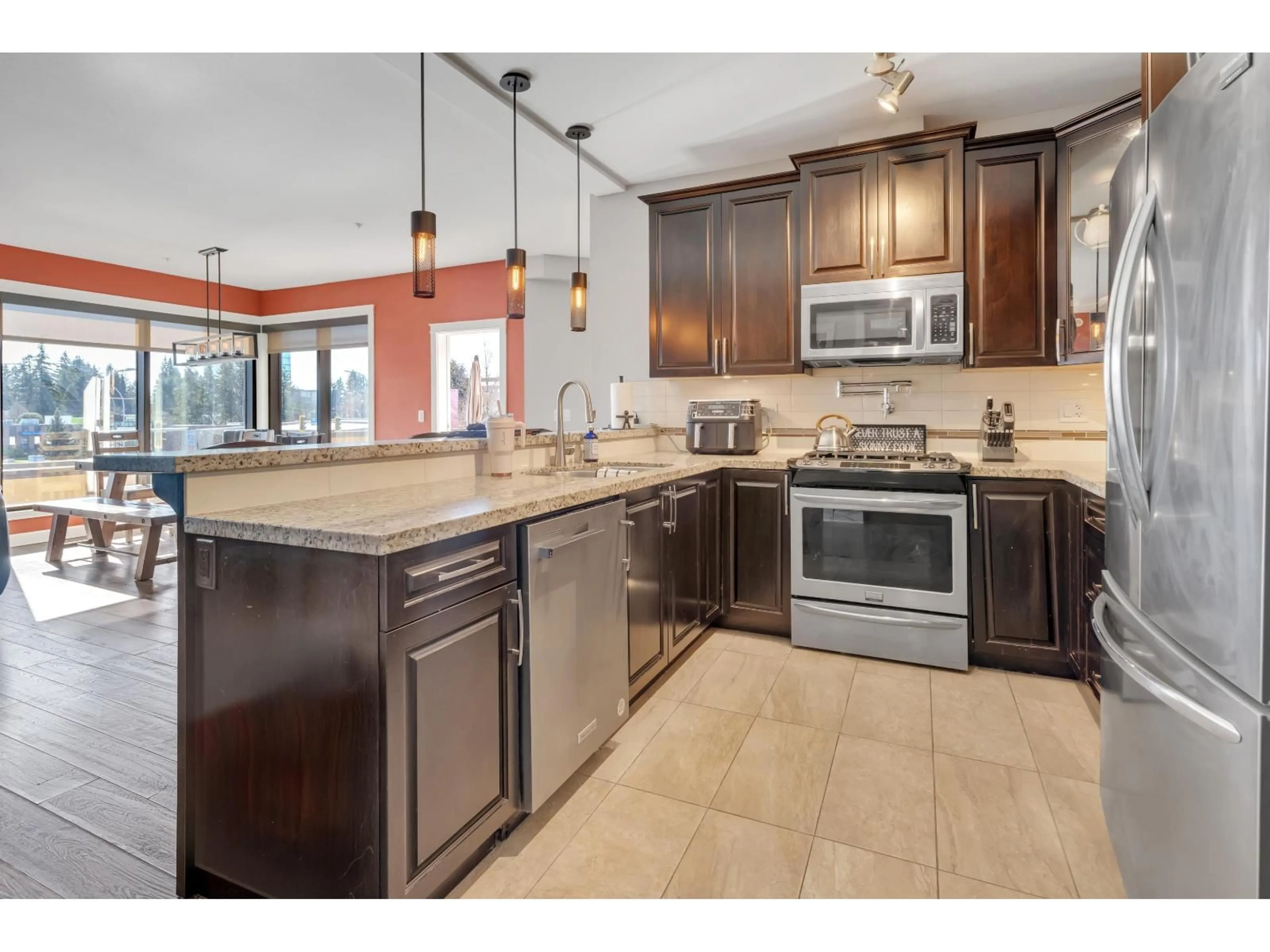 Open concept kitchen, ceramic/tile floor for 326 - 2860 TRETHEWEY STREET, Abbotsford British Columbia V2T0G5