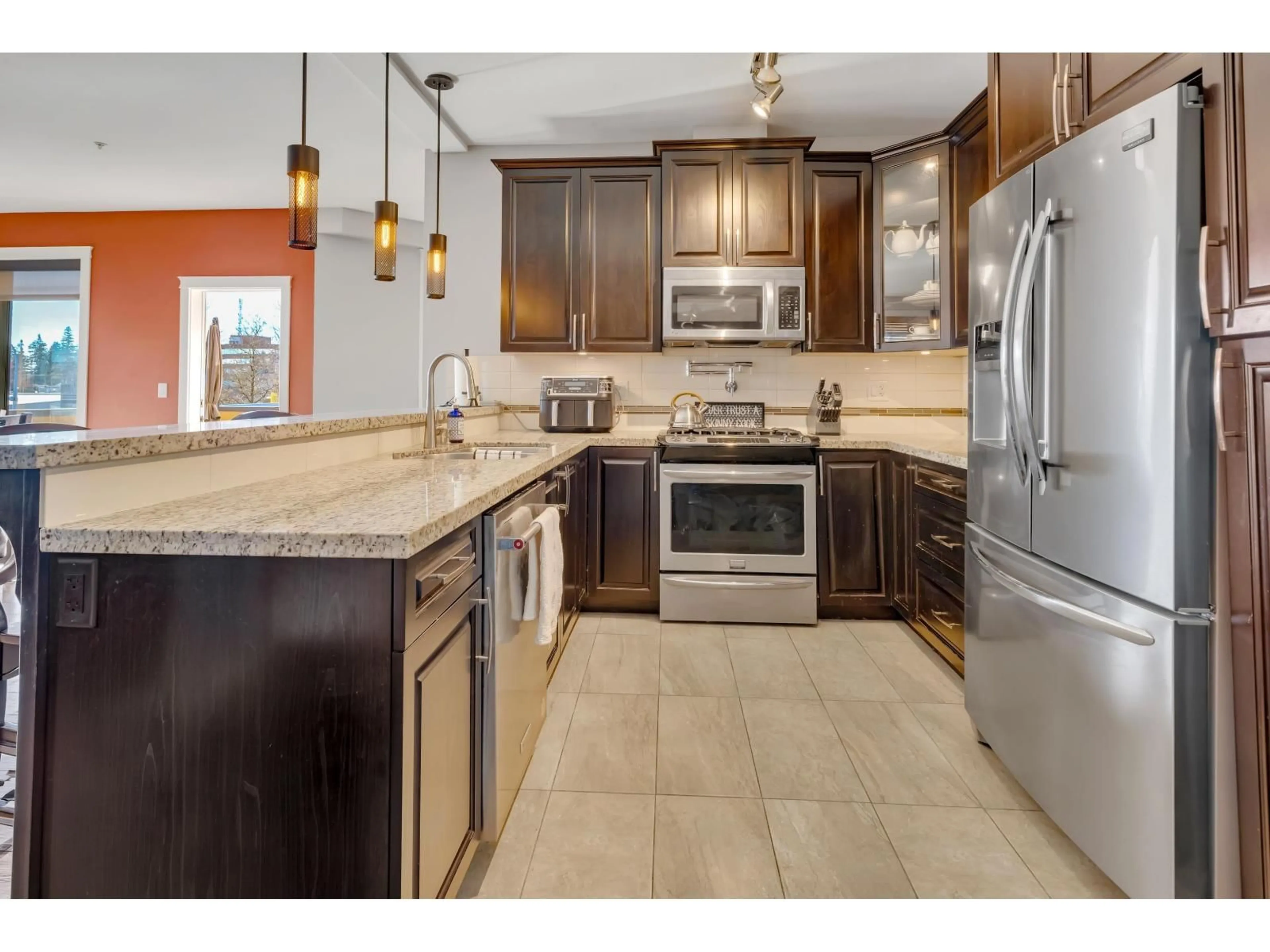 Open concept kitchen, ceramic/tile floor for 326 - 2860 TRETHEWEY STREET, Abbotsford British Columbia V2T0G5