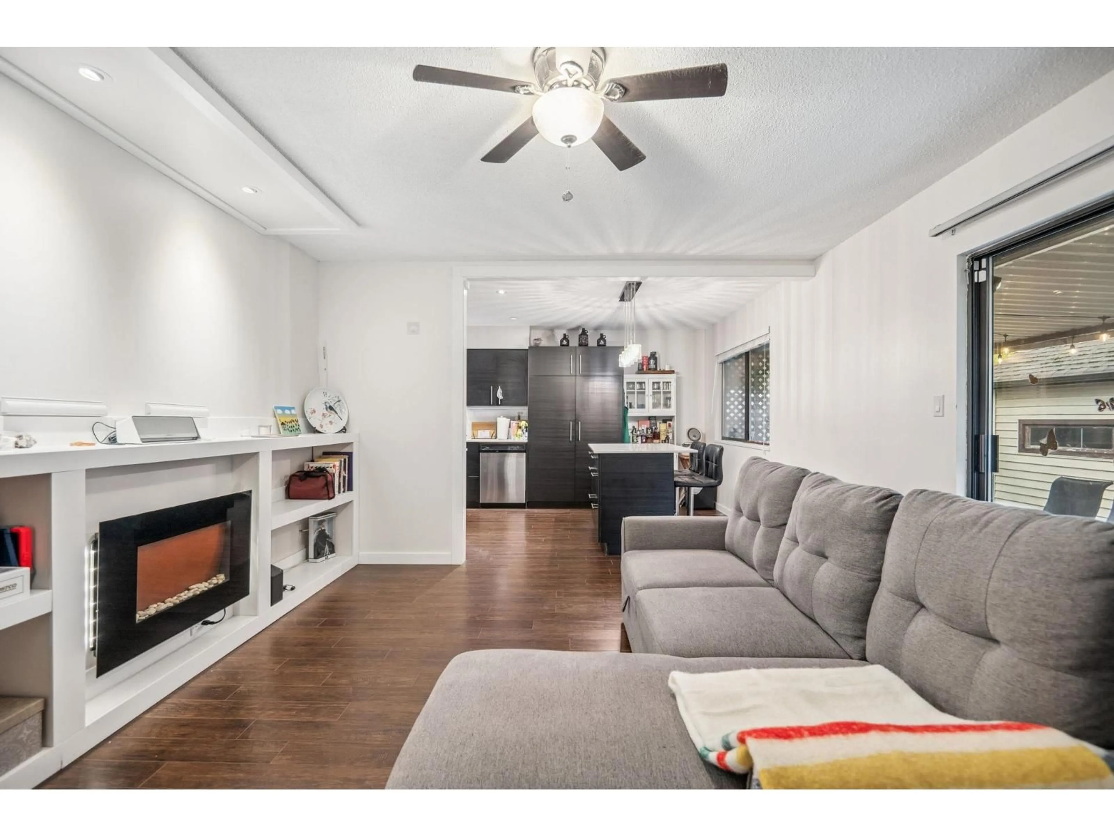 Living room with furniture, wood/laminate floor for 6103 172B STREET, Surrey British Columbia V3S6G6