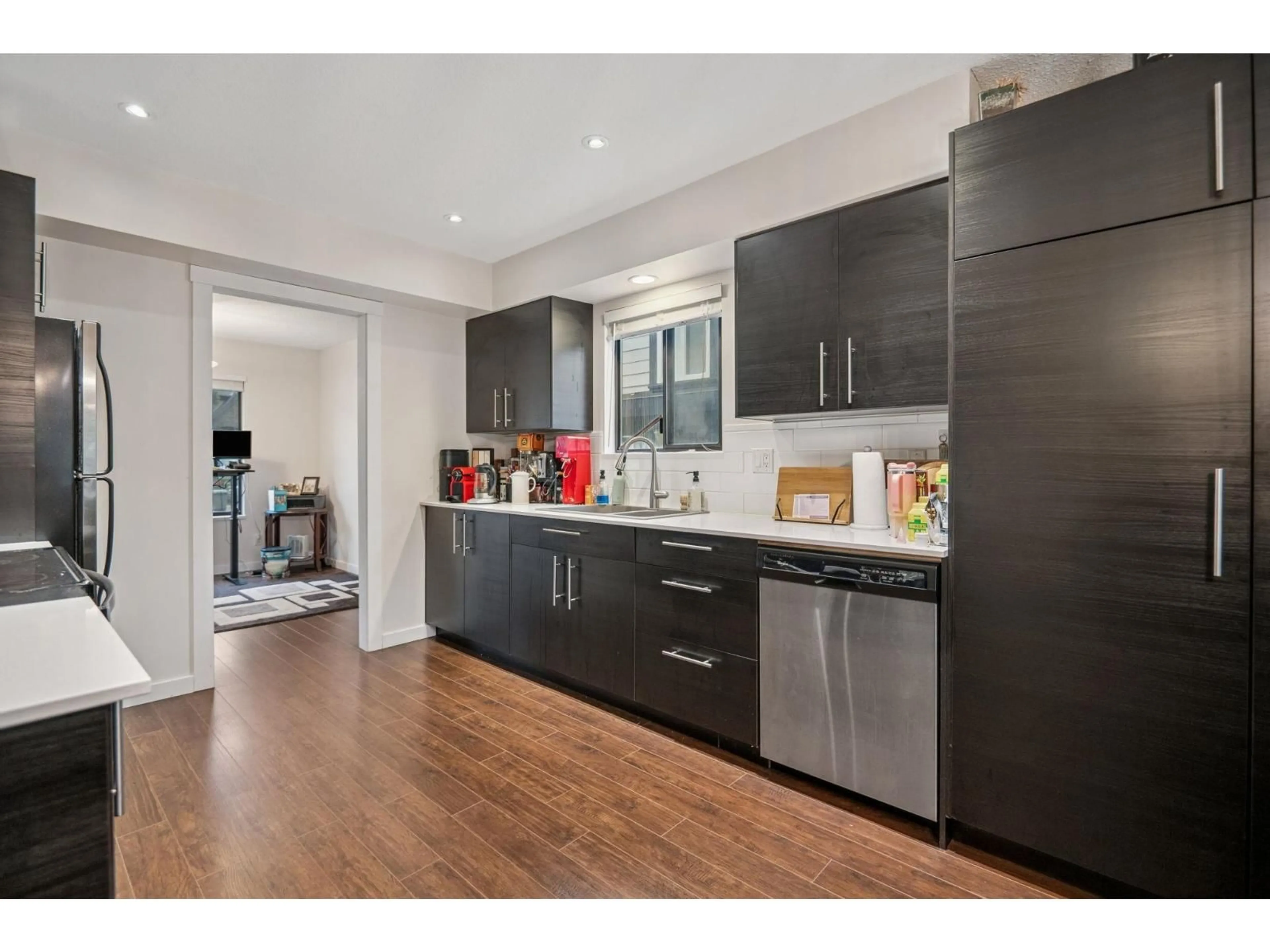 Open concept kitchen, wood/laminate floor for 6103 172B STREET, Surrey British Columbia V3S6G6