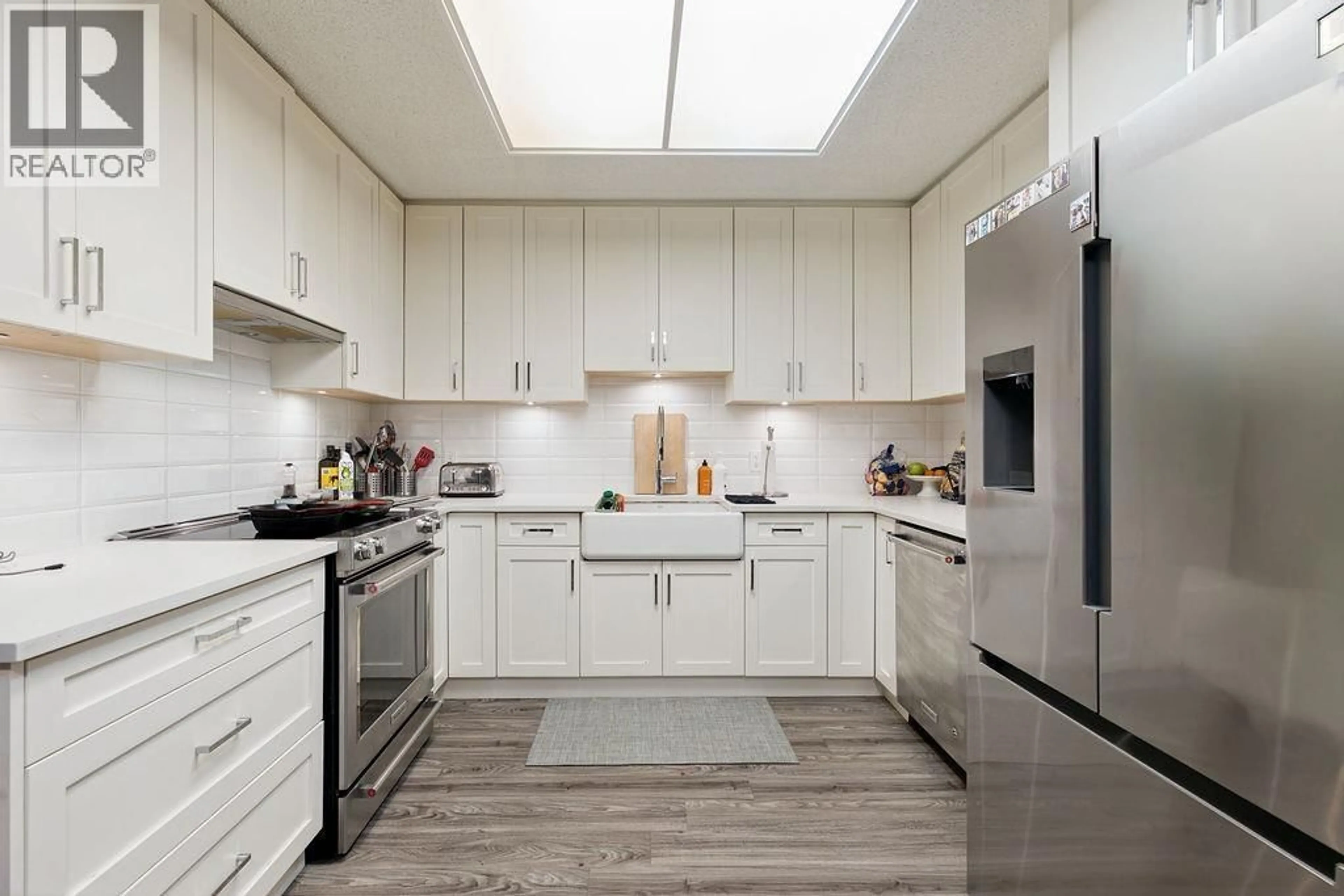 Contemporary kitchen, ceramic/tile floor for 4418 YEW STREET, Vancouver British Columbia V6L3C8