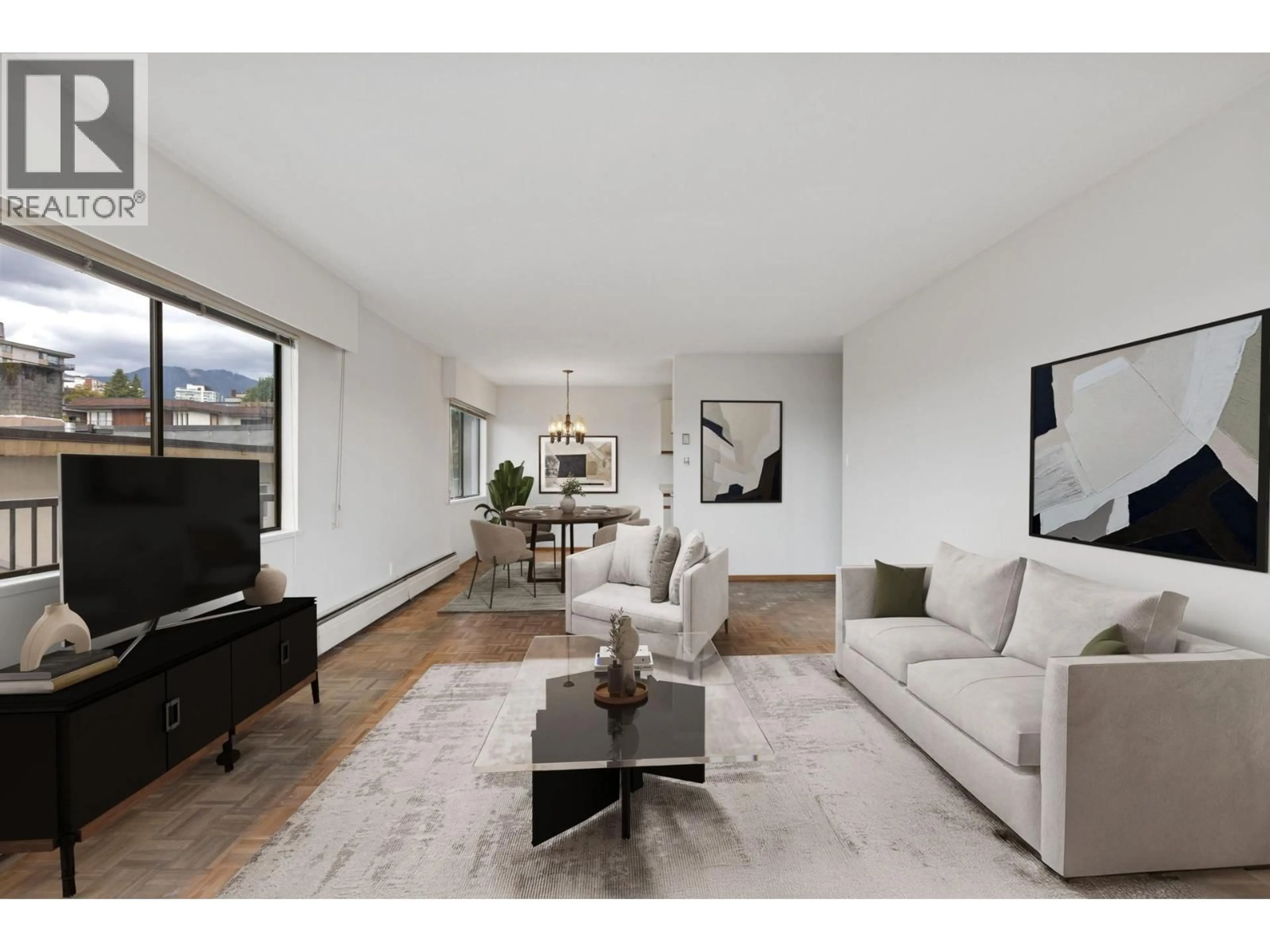 Living room with furniture, unknown for 211 - 155 5TH STREET, North Vancouver British Columbia V7L1L3