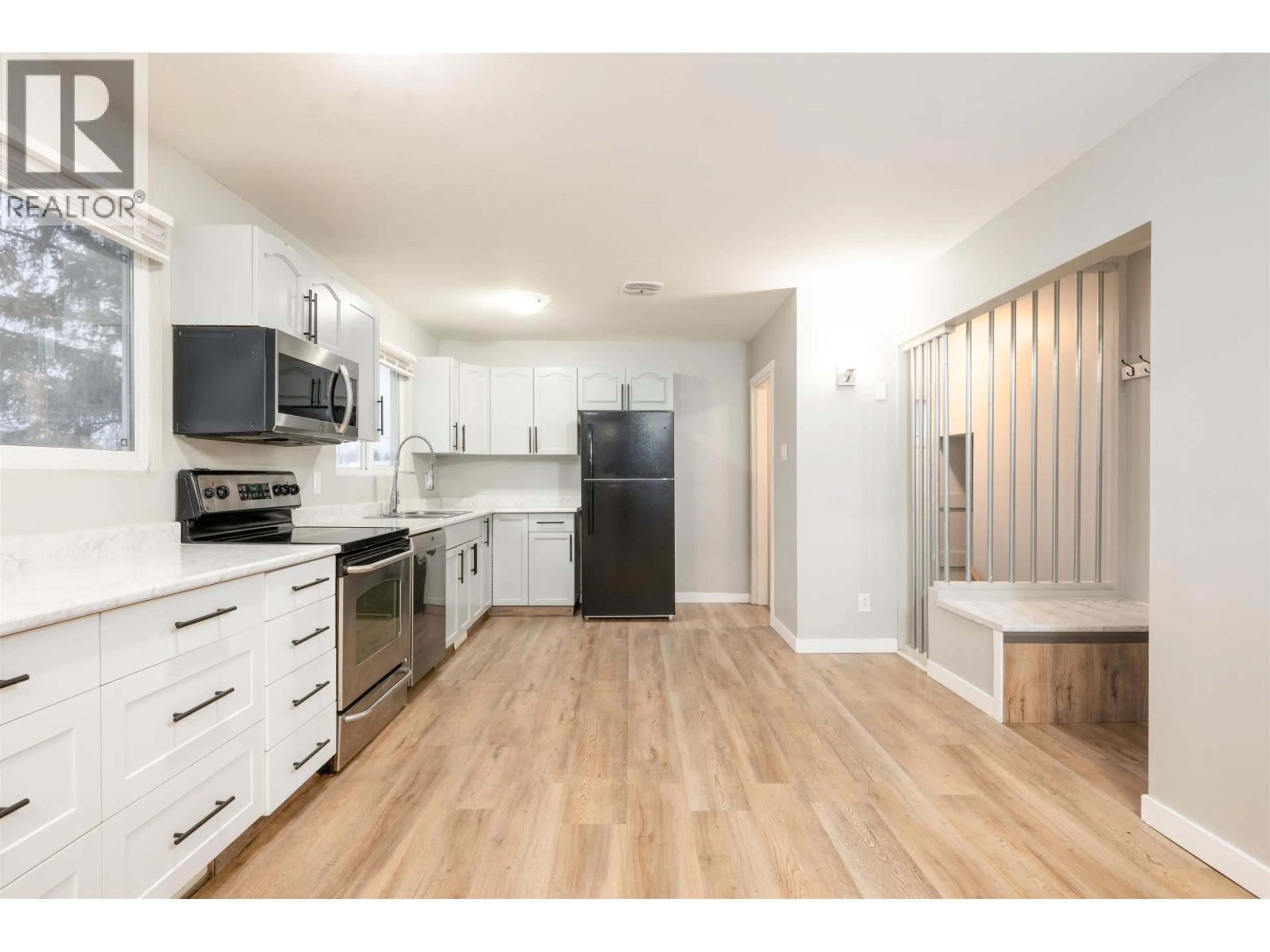 Open concept kitchen, wood/laminate floor for 439 OGILVIE STREET, Prince George British Columbia V2M3M4