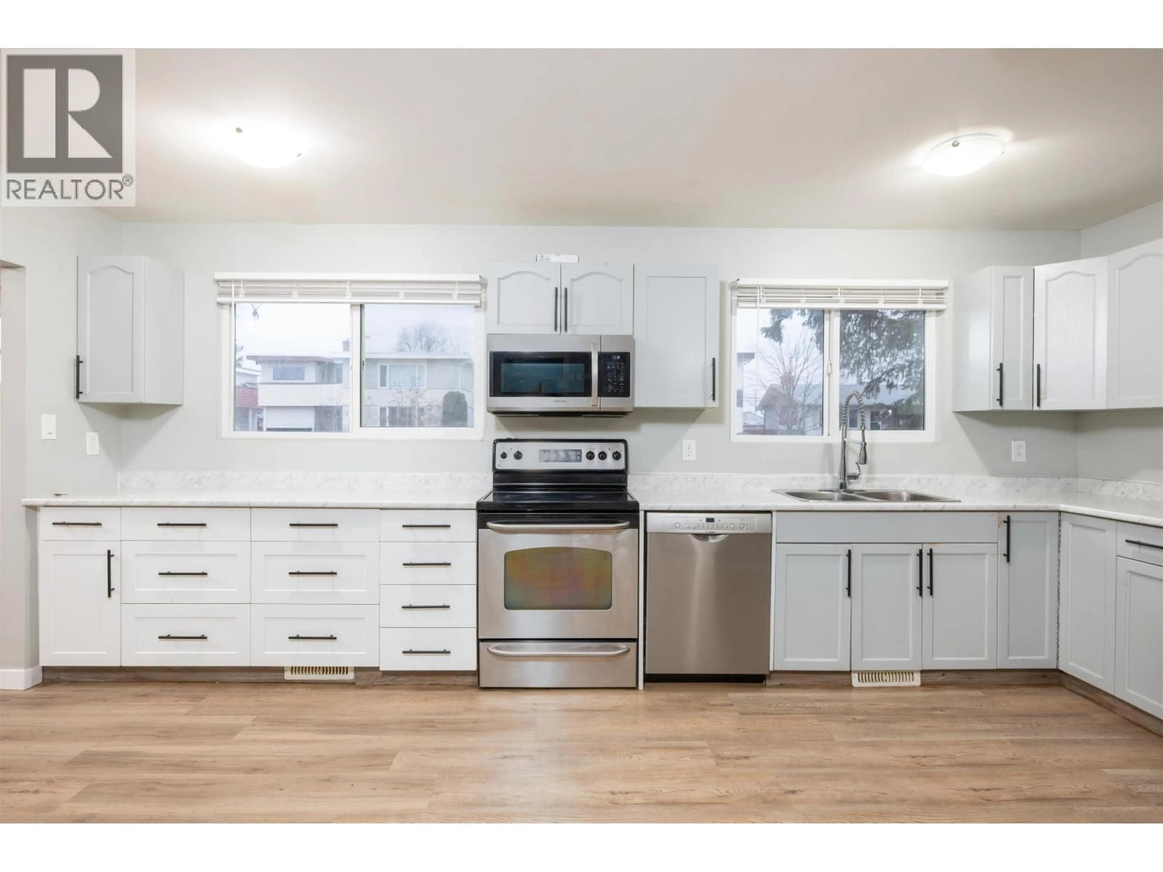 Open concept kitchen, wood/laminate floor for 439 OGILVIE STREET, Prince George British Columbia V2M3M4